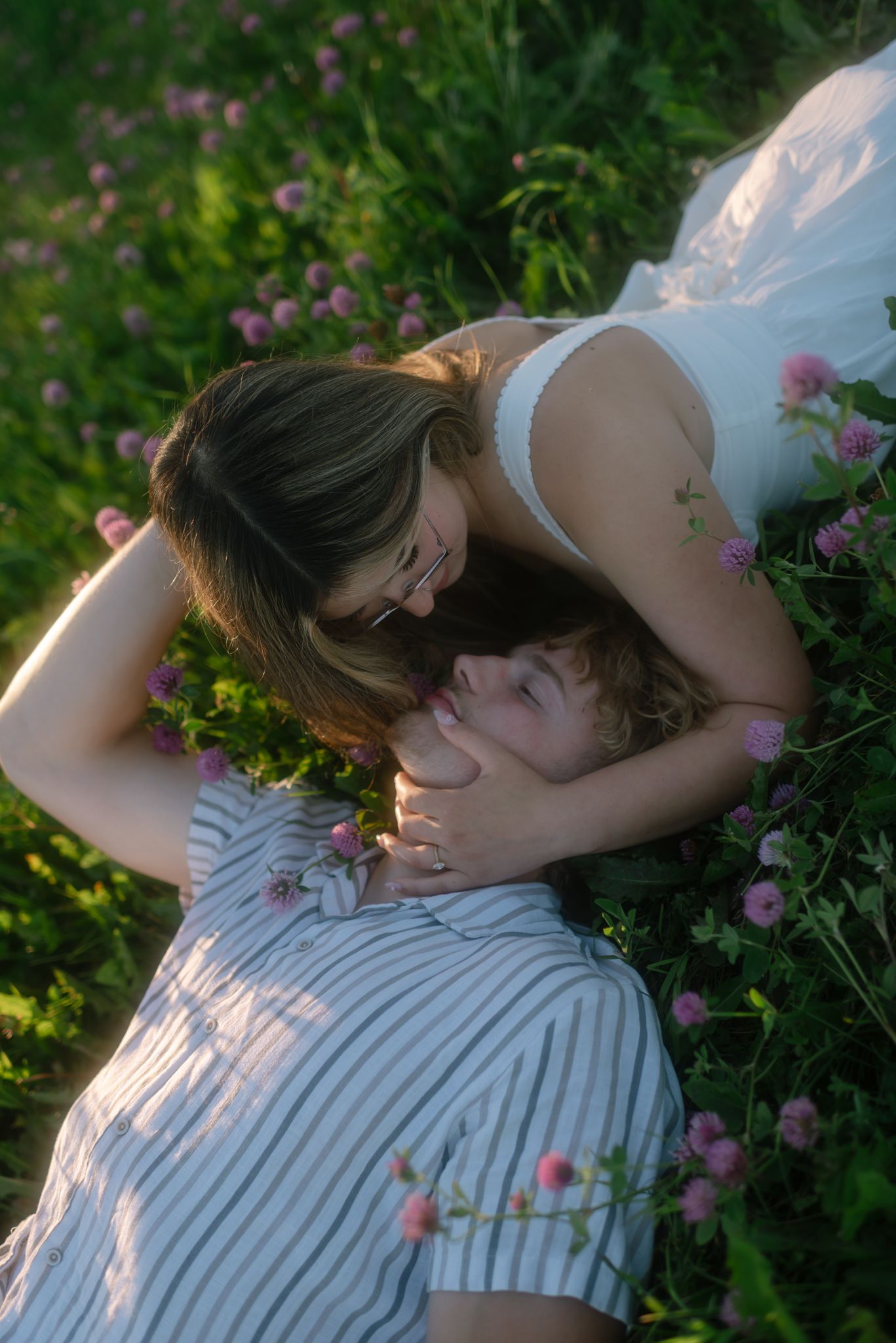 Romantic couples photography session of a couple embracing in a wildflower meadow.