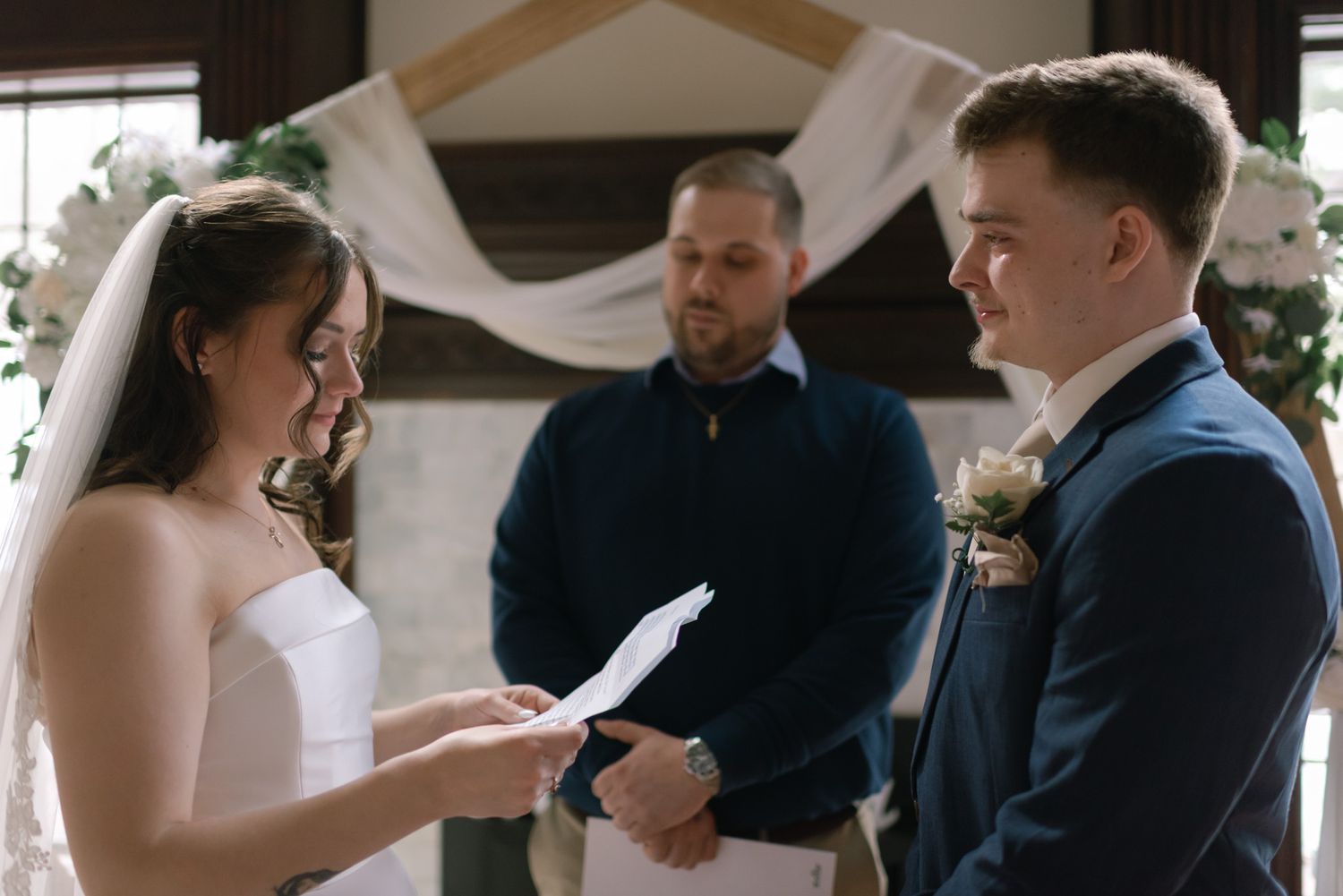 Bride and groom sharing a heartfelt vow moment with happy tears during their micro wedding in Fairbanks, Alaska.