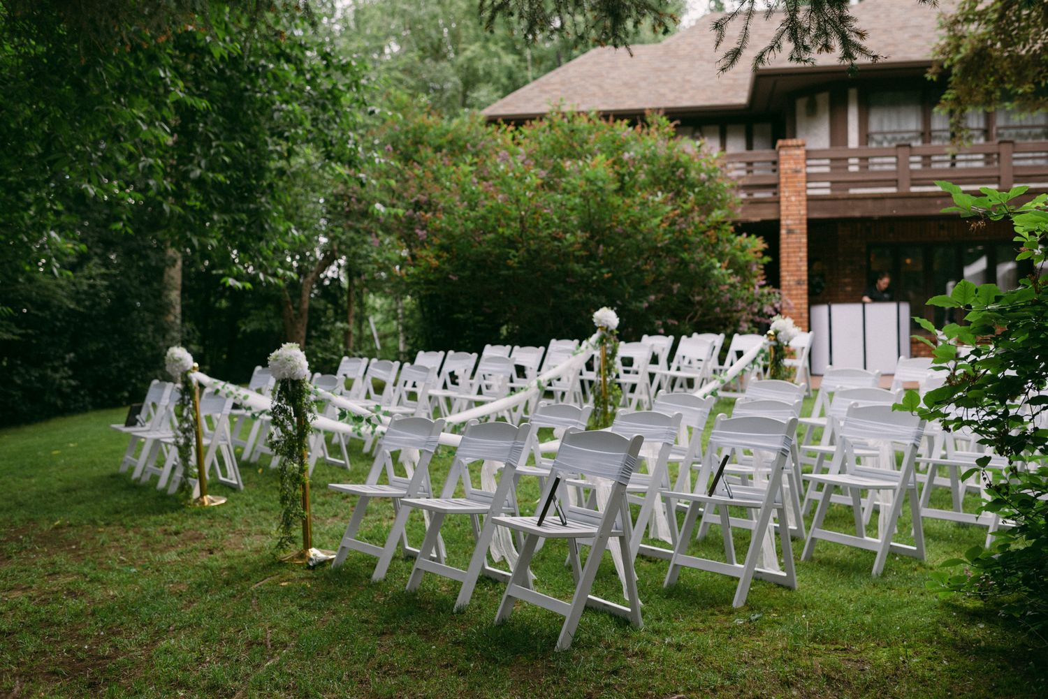 Pre-wedding ceremony setup with chairs and floral decorations at Huffman Manor in Fairbanks, Alaska.