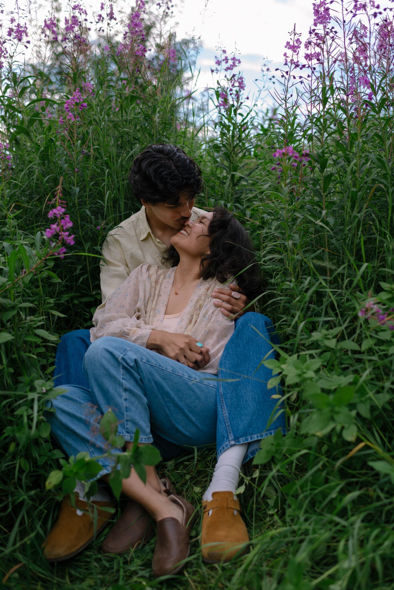 Romantic couple portraits surrounded by Alaska fireweed during a summer session in Fairbanks.