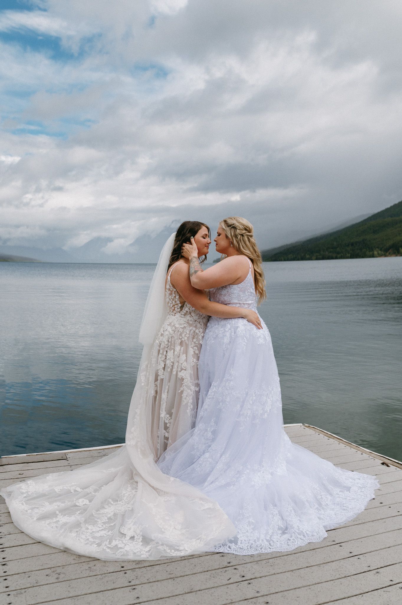 Glacier National Park Montana wedding photographer capturing an intimate couple celebration surrounded by mountain views.