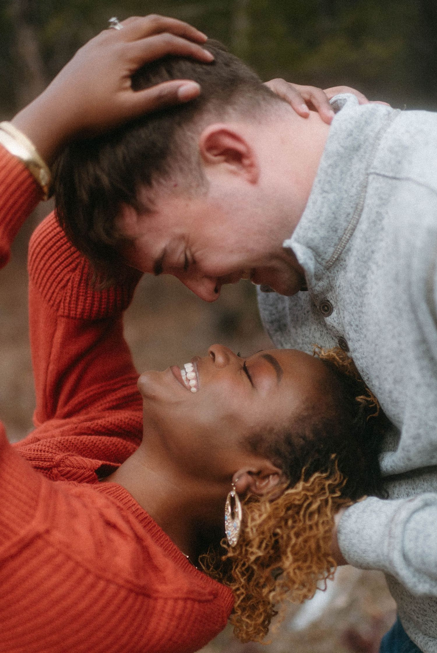 Couple having fun and being silly, enjoying a lighthearted moment together in the beautiful outdoors of Great Falls, Montana.