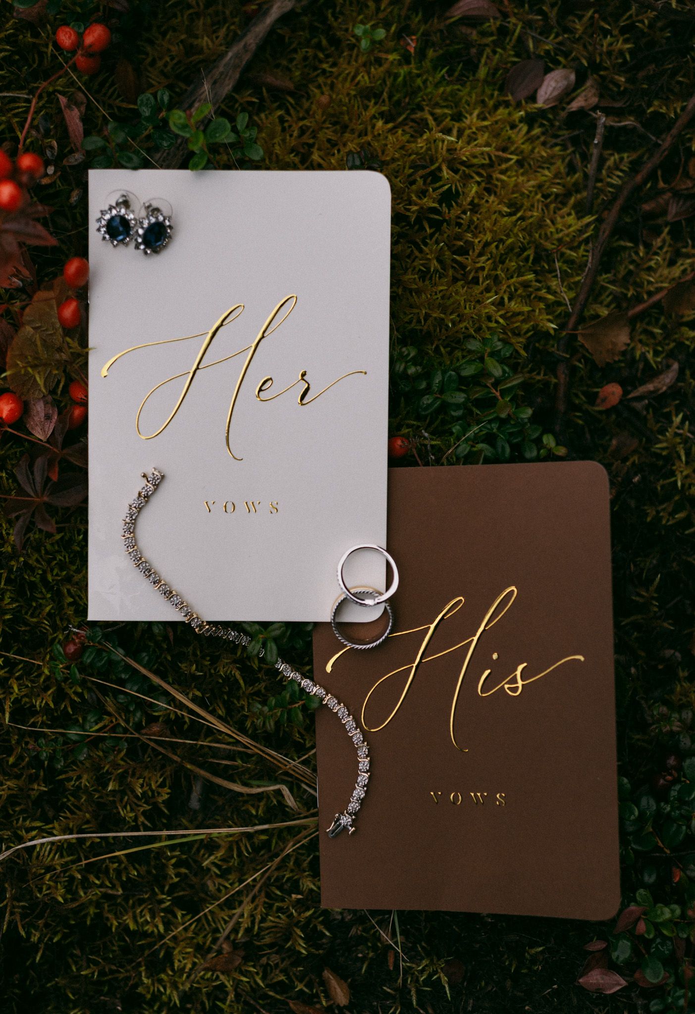 Captured wedding details of the couple’s vows, bridal earrings, and jewelry in the scenic Denali National Park, Alaska.