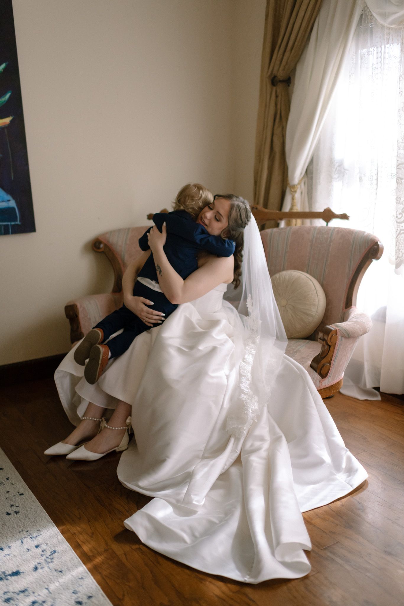 Fairbanks, Alaska wedding photographer capturing a tender moment between a bride and her son before walking down the aisle.