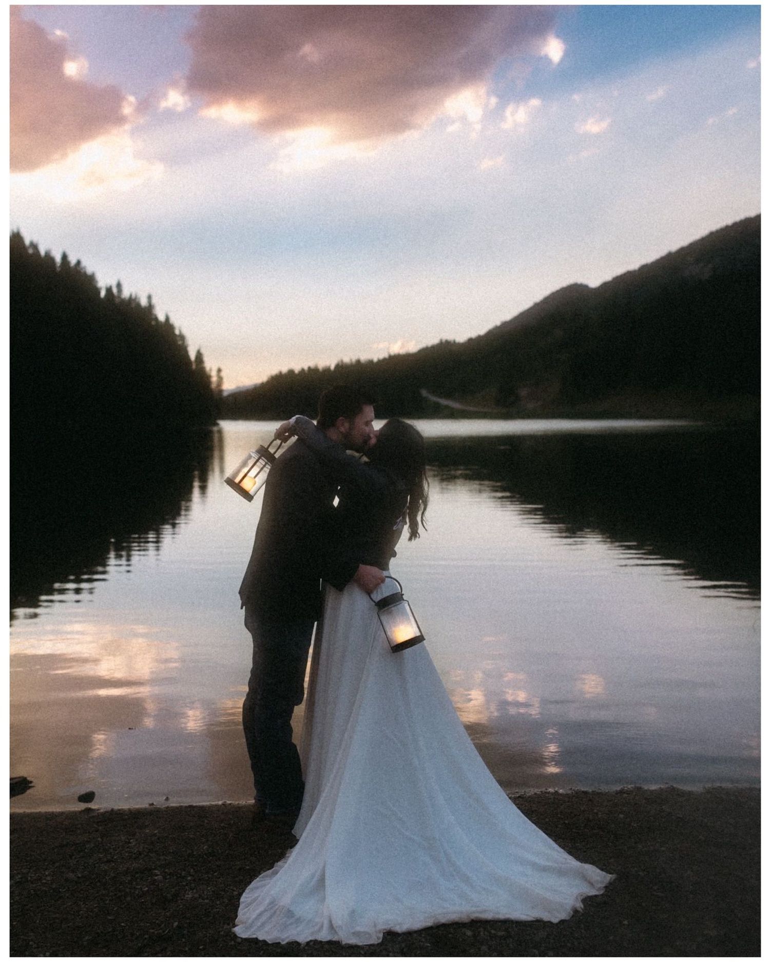 Romantic evening portrait of bride and groom during blue hour surrounded by Montana landscapes.
