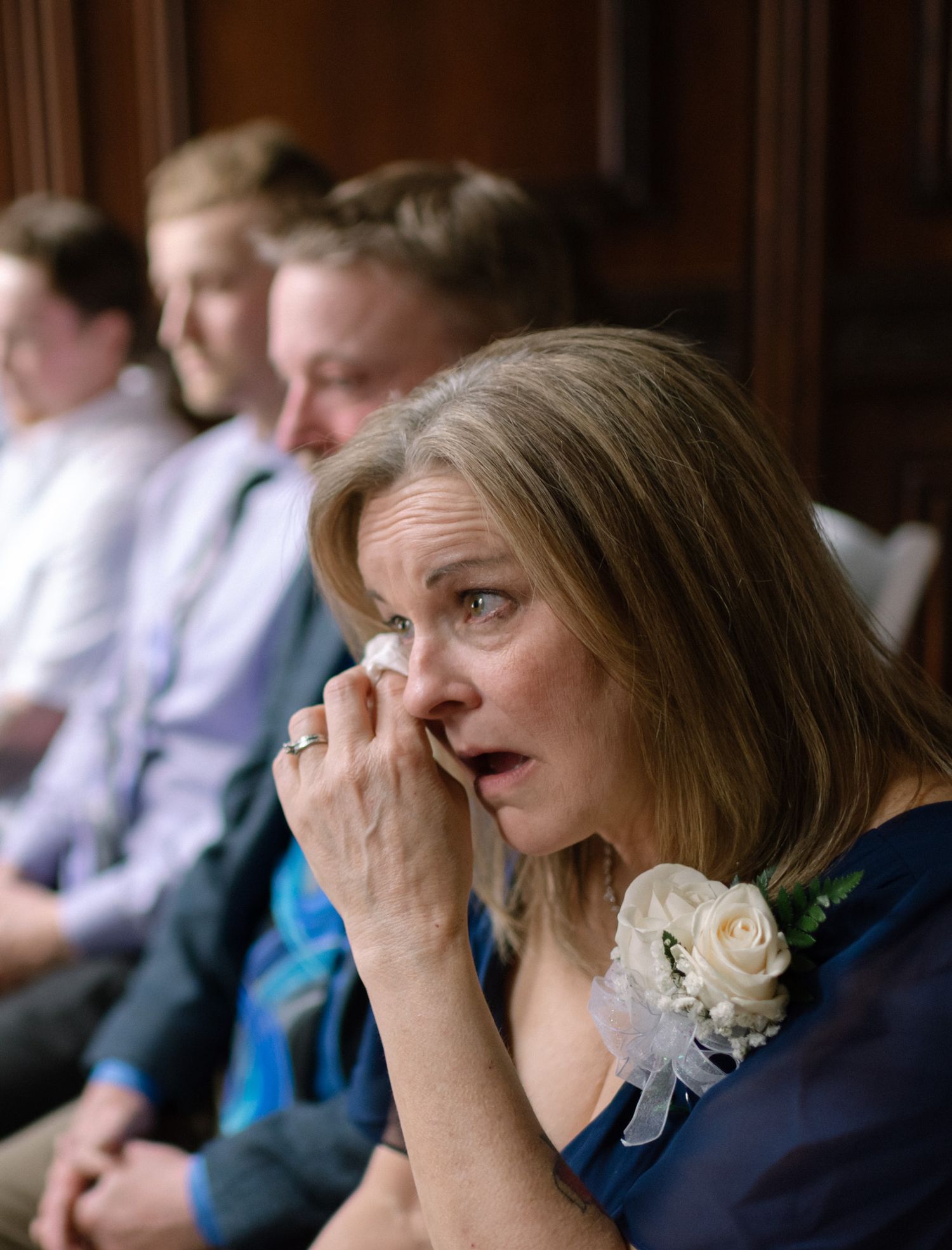 Mother of the groom sharing an emotional moment during her son’s wedding ceremony in Fairbanks, Alaska.