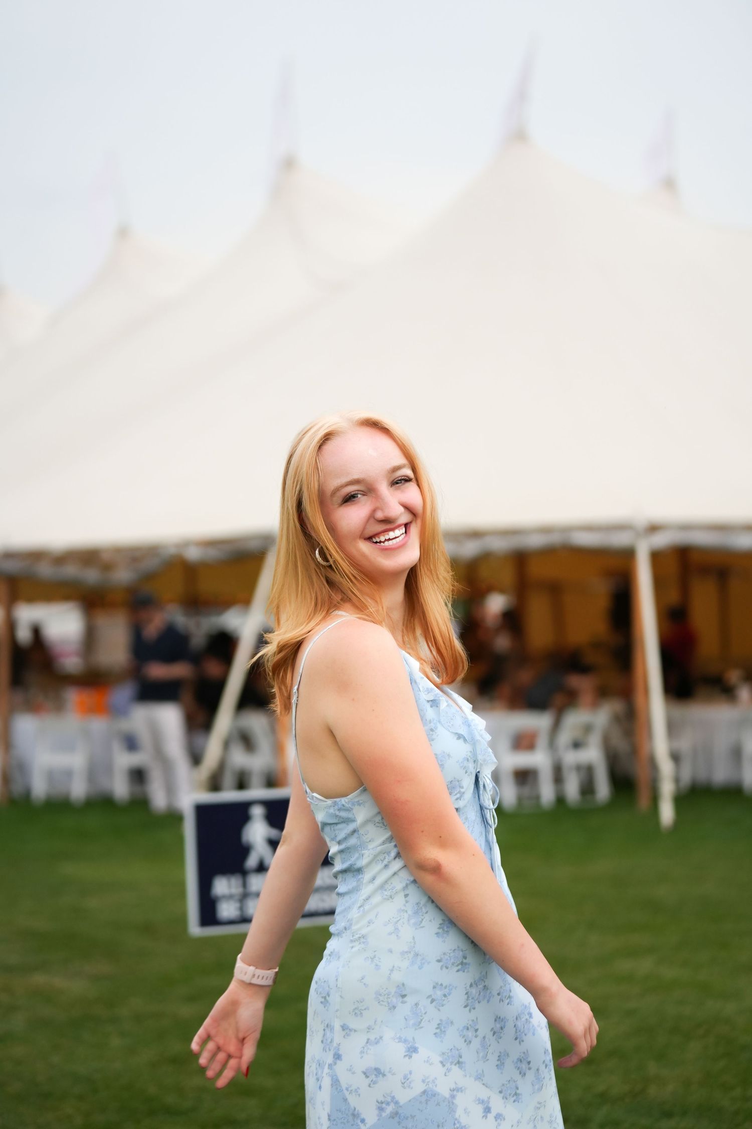 Natural light portrait photography of subject in outdoor setting with soft background blur.