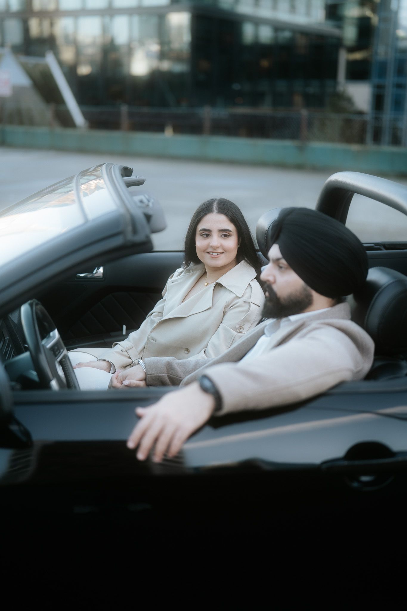 A series of shots showing someone reclining in a black car against an urban backdrop.
