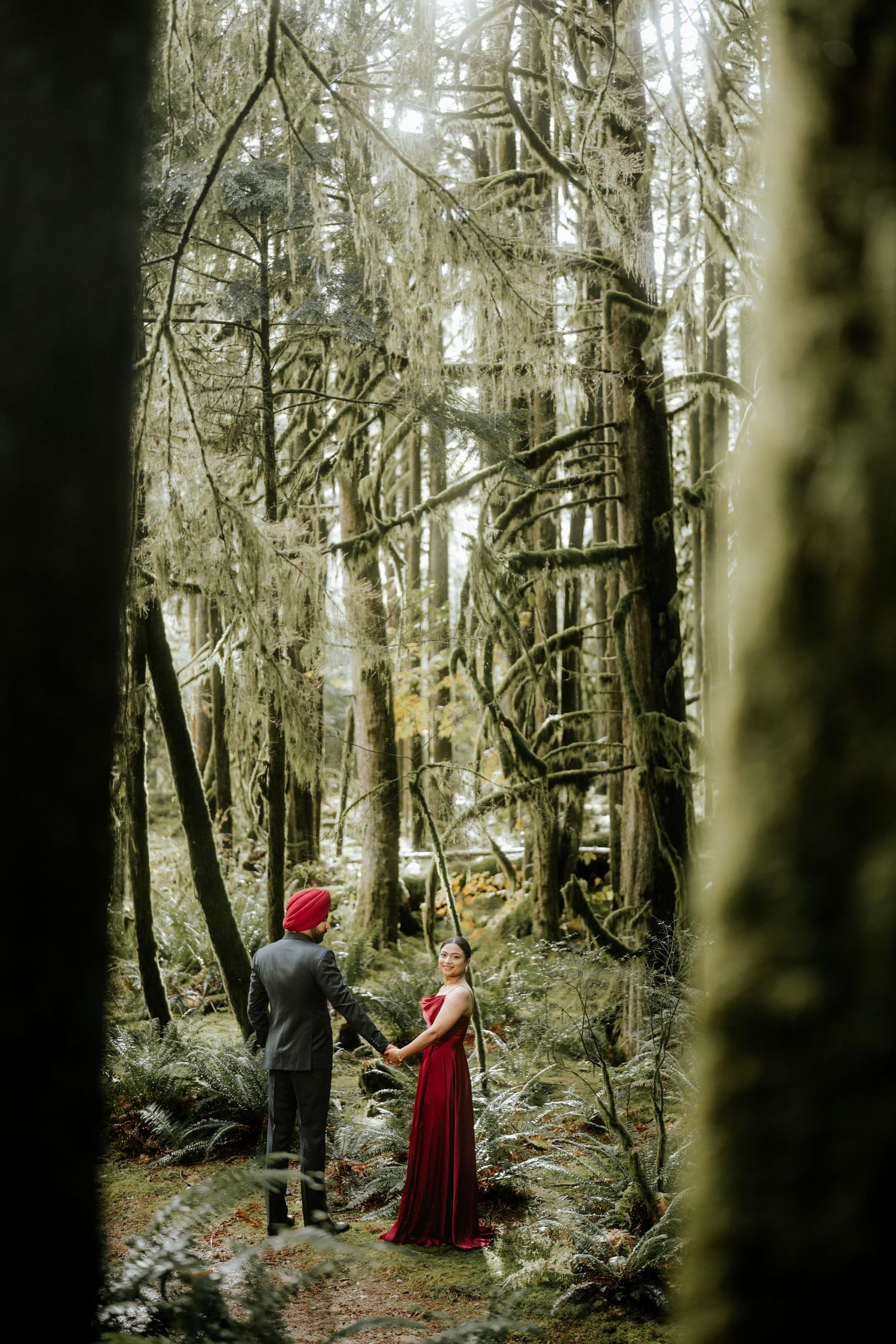 Artistic series showing two people in formal wear exploring a mystical forest landscape.