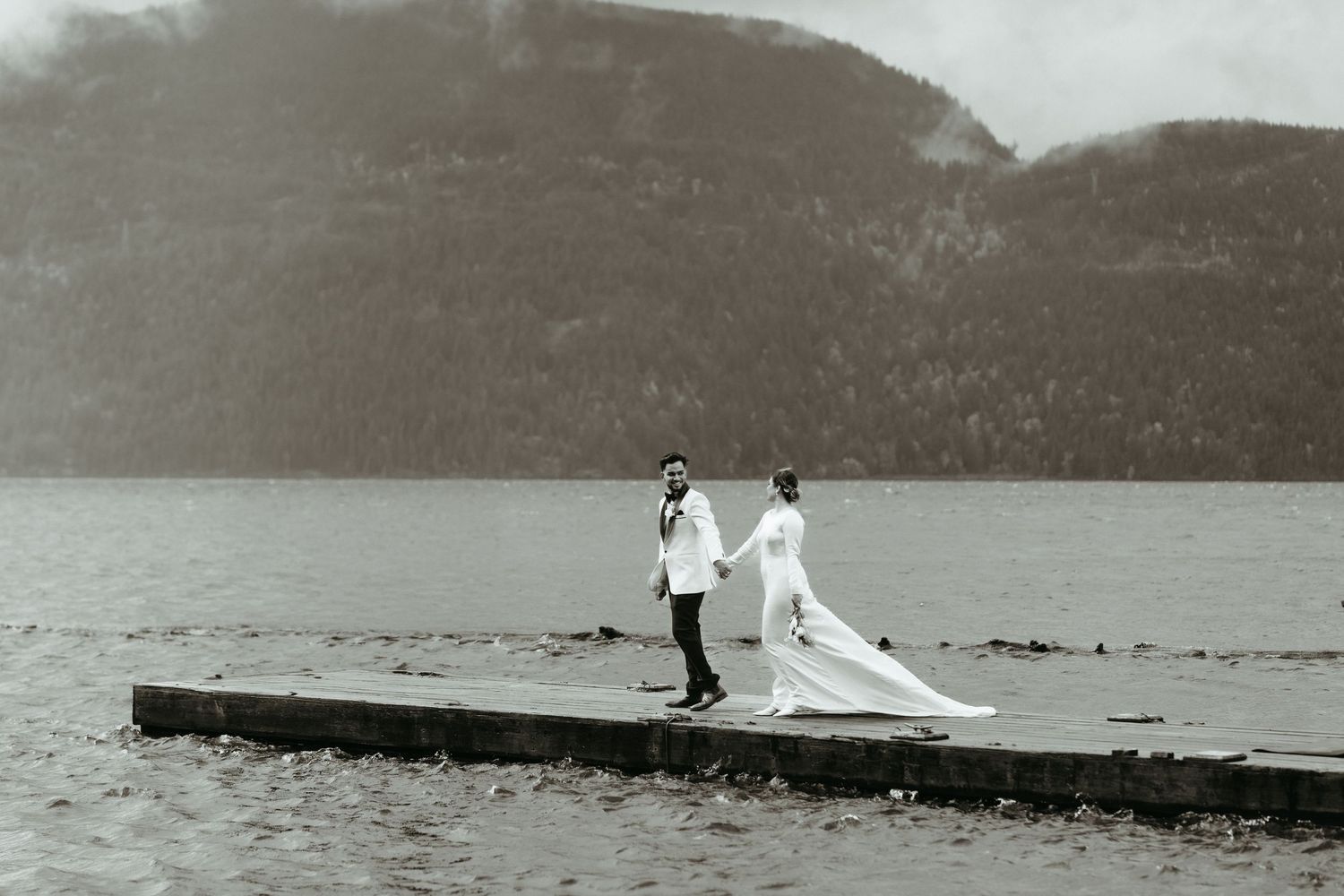 A series of vintage black and white photographs showing a lake or coastal scene with figures on a dock.