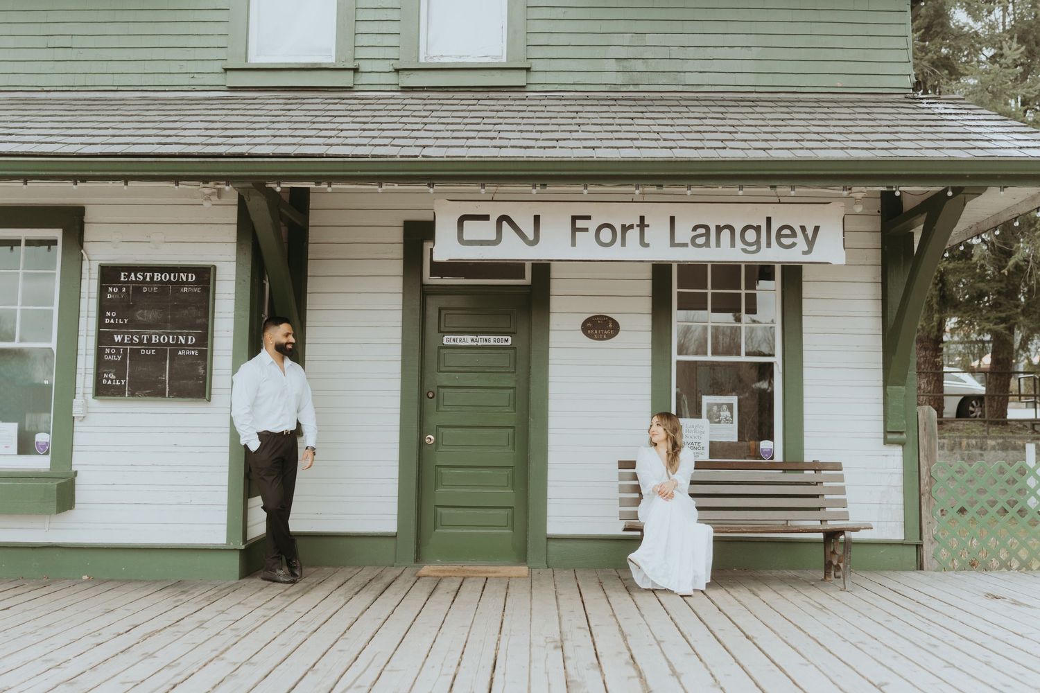 Historic Fort Langley building exterior with wooden boardwalk and green siding.