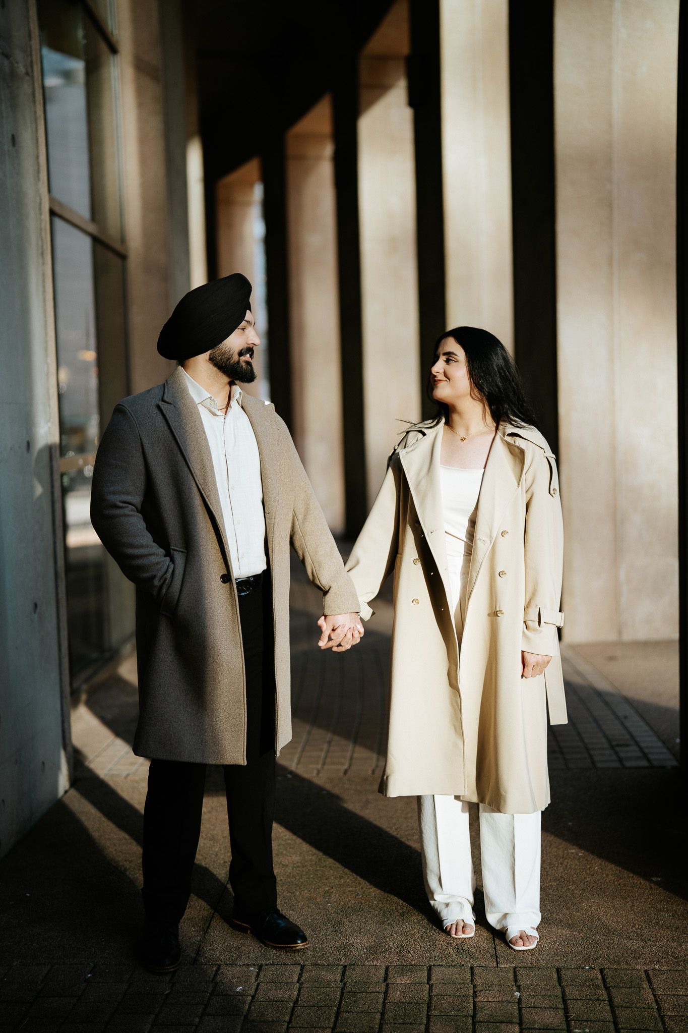 A series of artistic wedding photos showing silhouettes and partial views of a couple in formal attire against a columned backdrop.