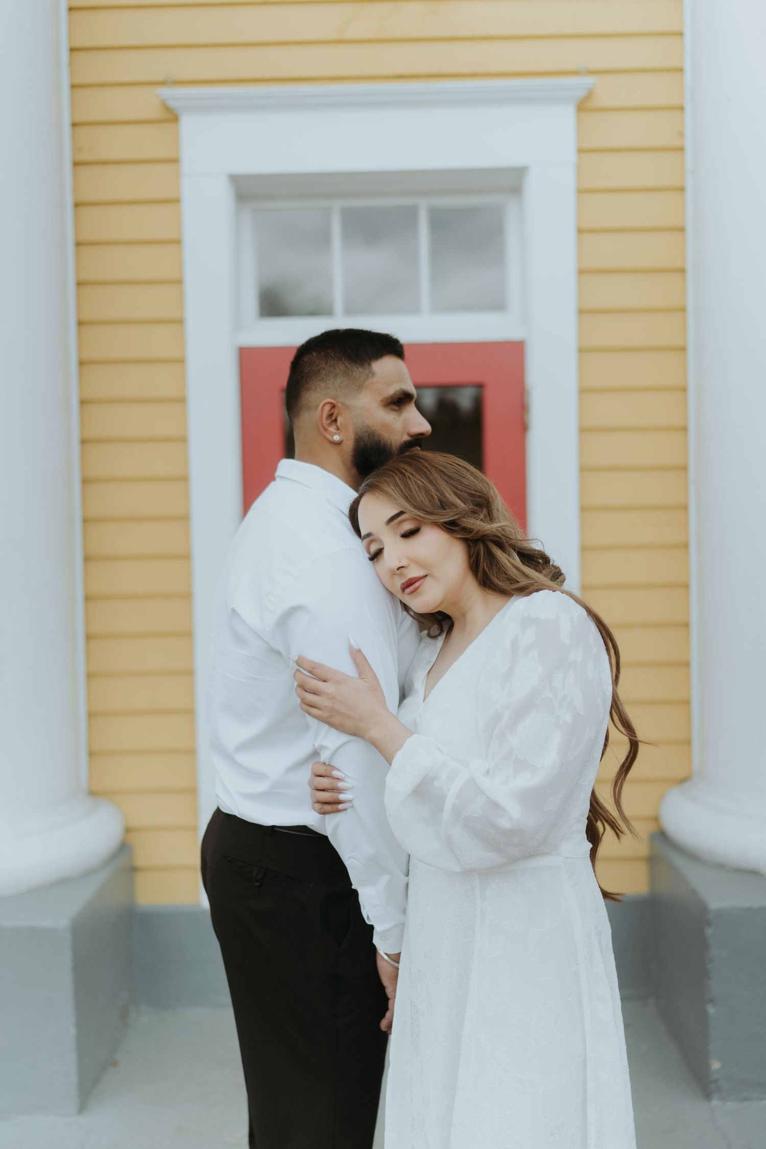 Candid moment of a couple laughing together during their photo session.