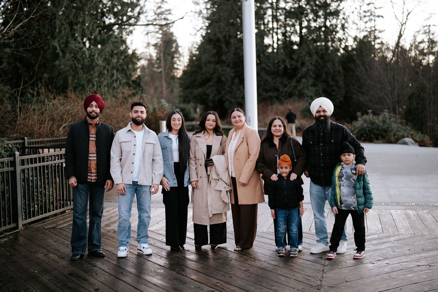 A group of people walking together in a casual outdoor setting at dusk.