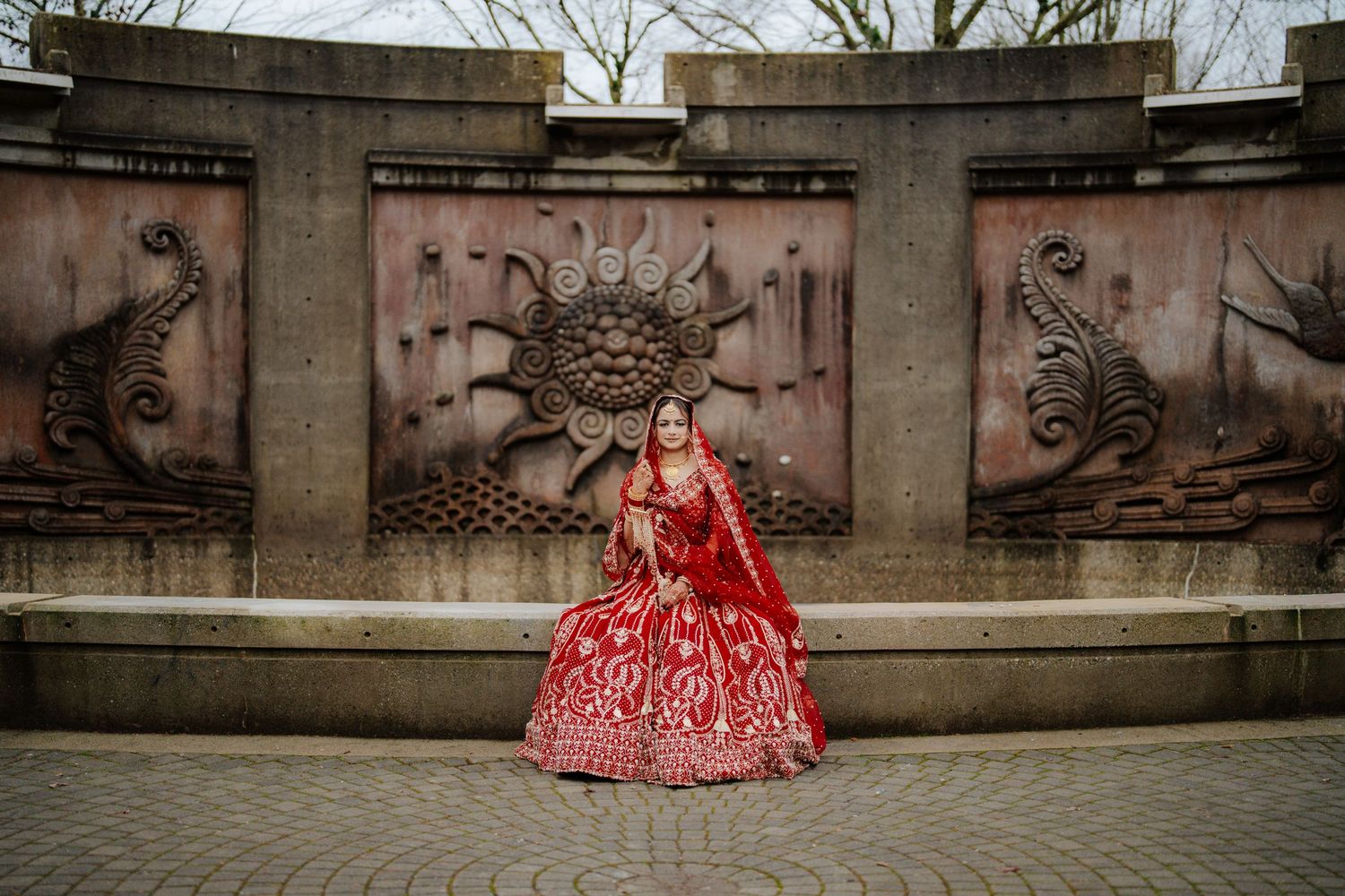 Romantic wedding photography session against stone architecture backdrop.