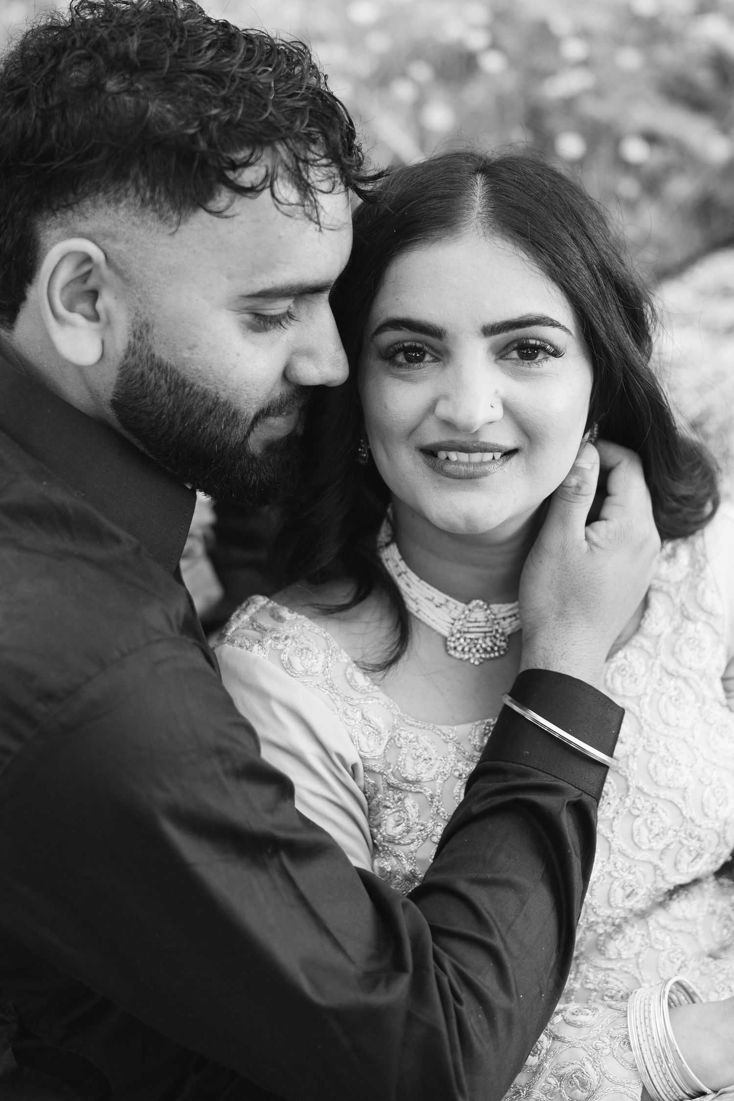 A romantic black and white photo series showing a tender moment between a couple.