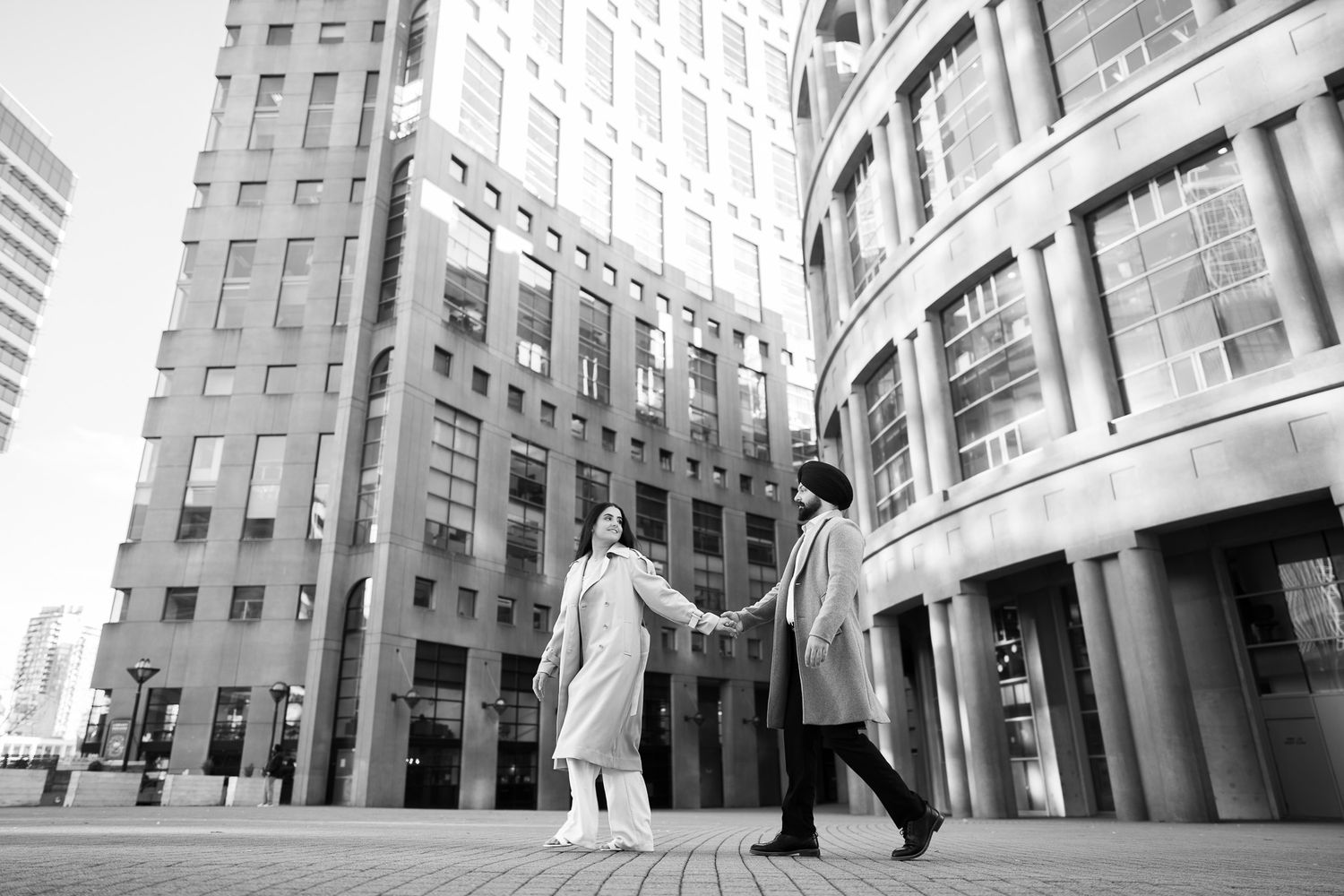 Modern office buildings with curved glass facades and architectural details shown from multiple angles in black and white.