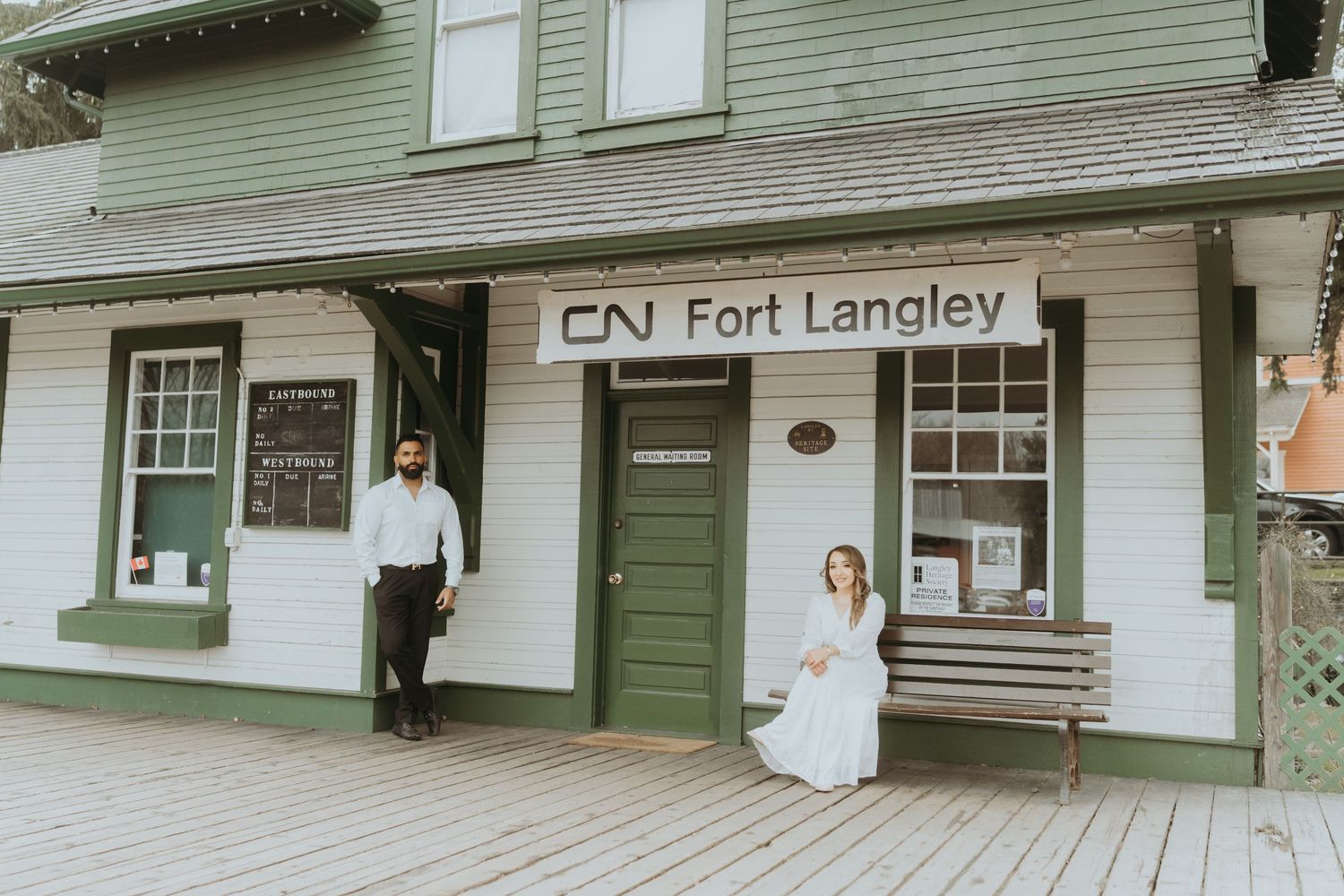 Historic CN Fort Langley building exterior with green siding and wooden boardwalk.