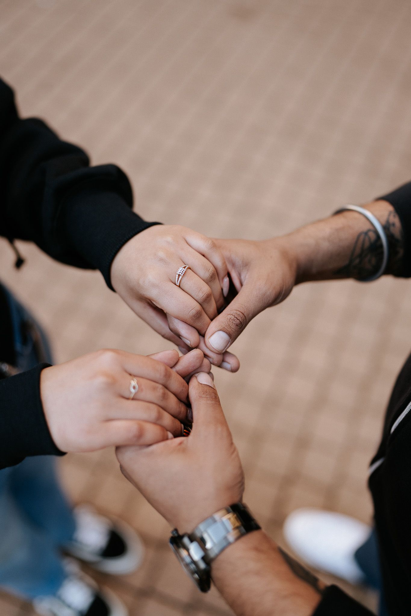 Close-up series of hands exchanging wedding rings during a marriage ceremony.