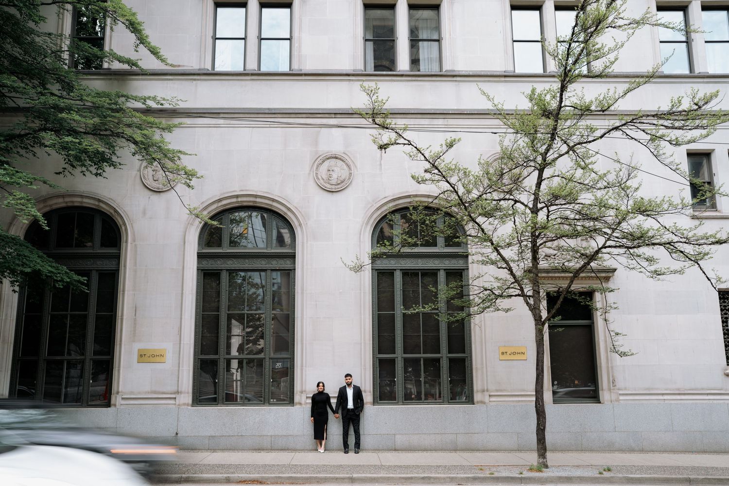 Exterior view of a historic building with arched windows and classical architecture.