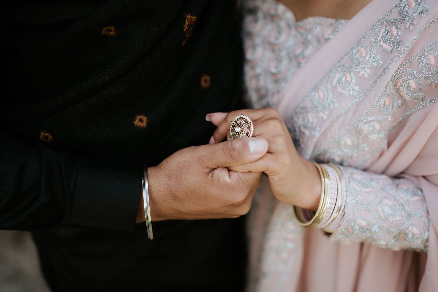 Close-up shots of hands wearing traditional jewelry and henna designs.