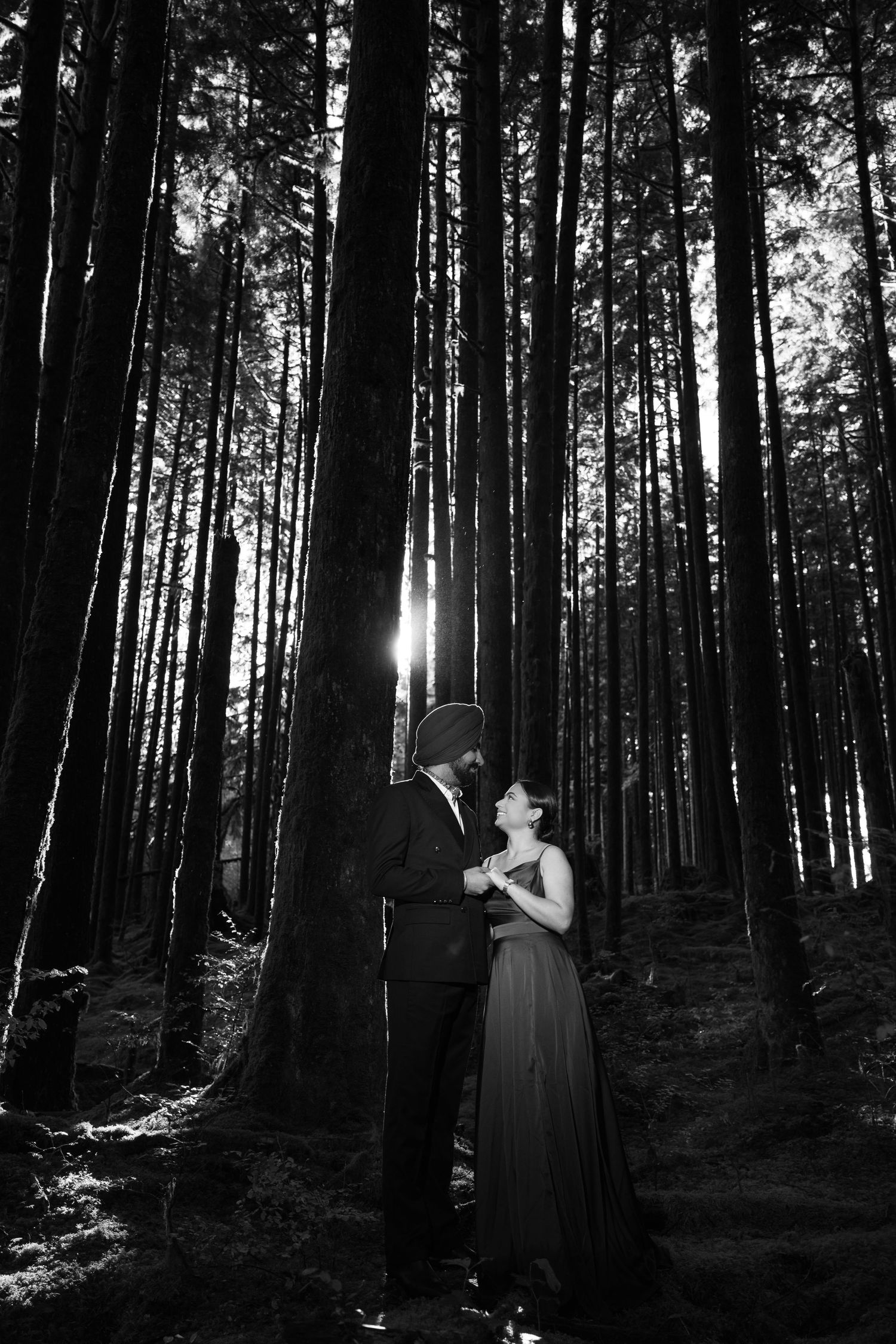 Moody black and white photo sequence in a dense forest with dramatic lighting.