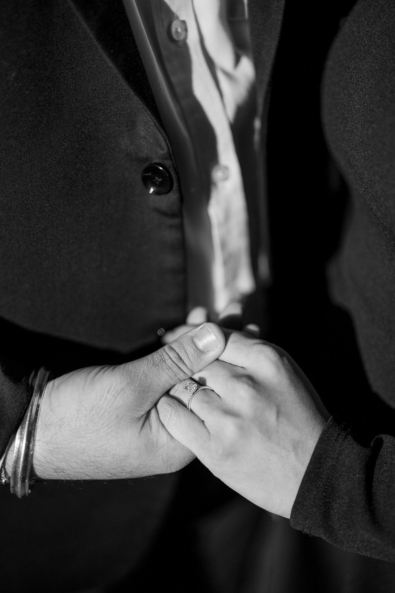 A sequence of black and white photographs showing two hands exchanging a business handshake in different stages.