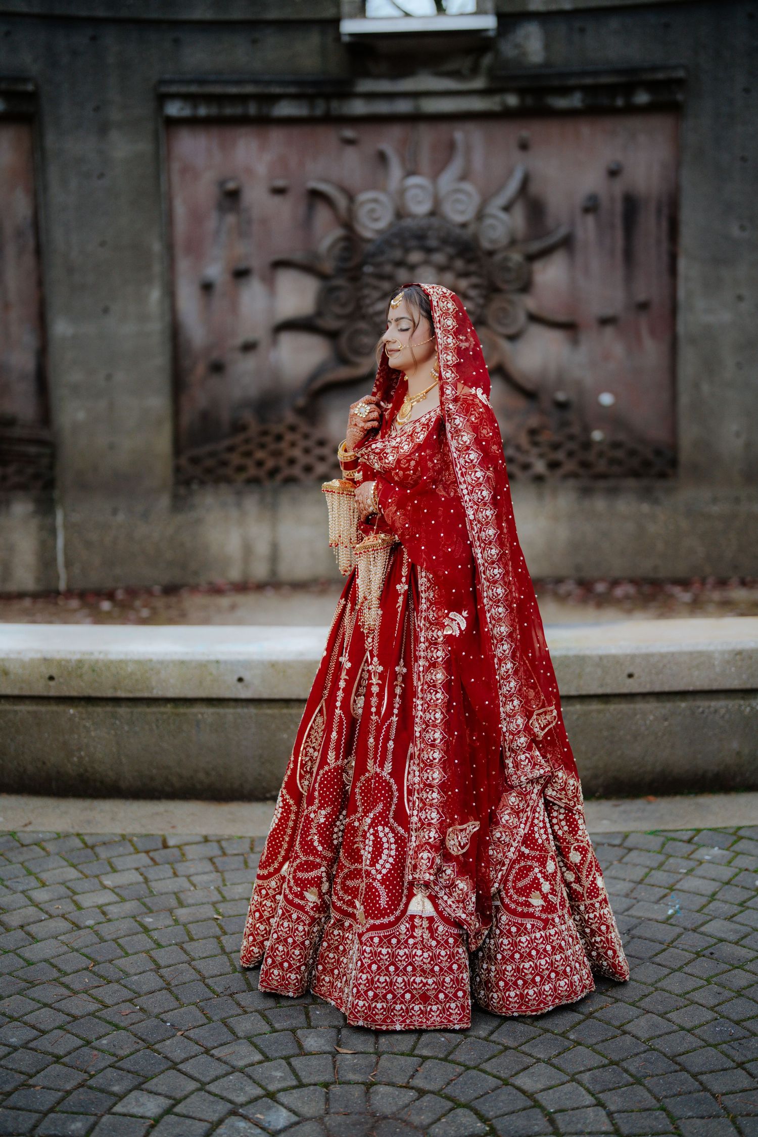 Bride in stunning red embroidered lehenga photographed from different angles.