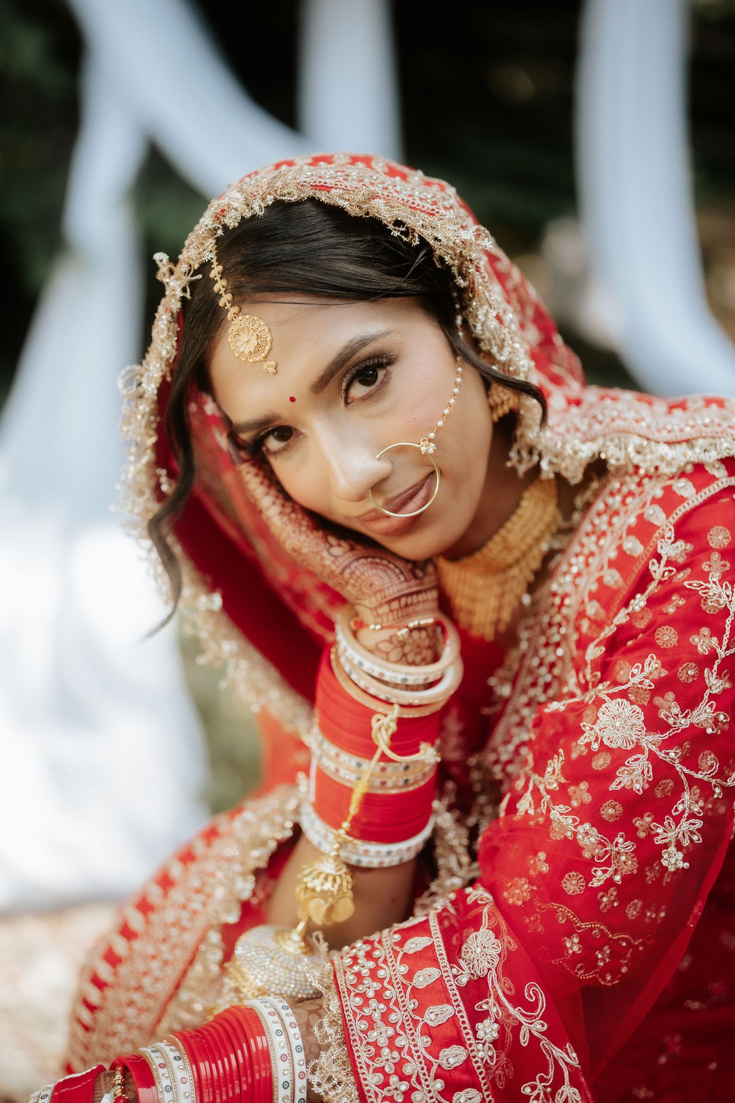 Series of close-up portraits showing intricate Indian bridal makeup and jewelry details.
