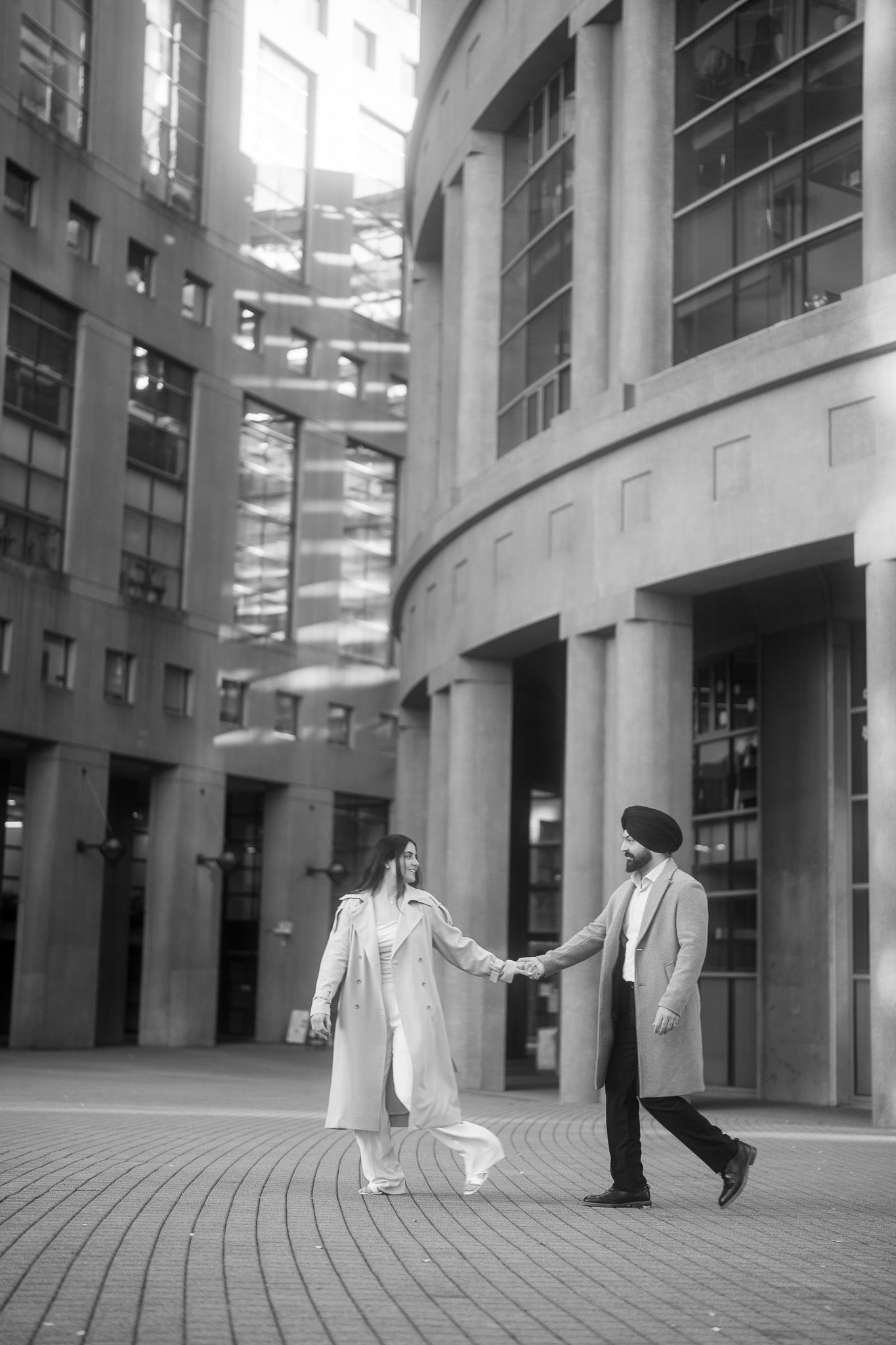 A series of black and white architectural photographs showing people walking between modern office buildings.