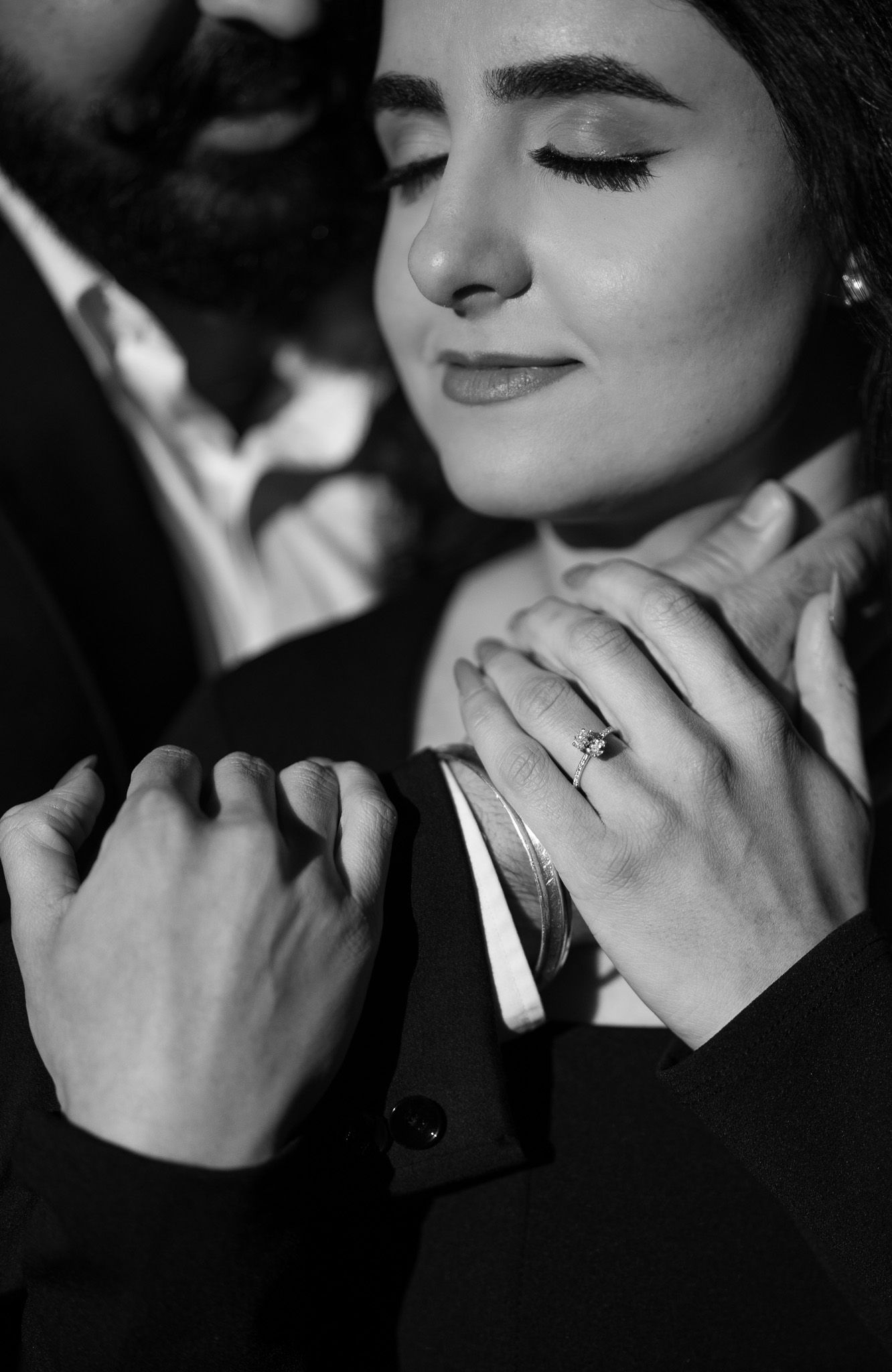 Black and white close-up photo sequence showing hands touching chin in dramatic lighting.