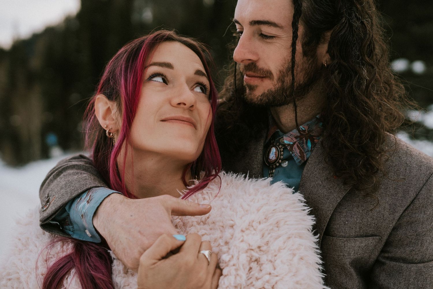Intimate winter wedding portraits against a mountain backdrop at sunset.