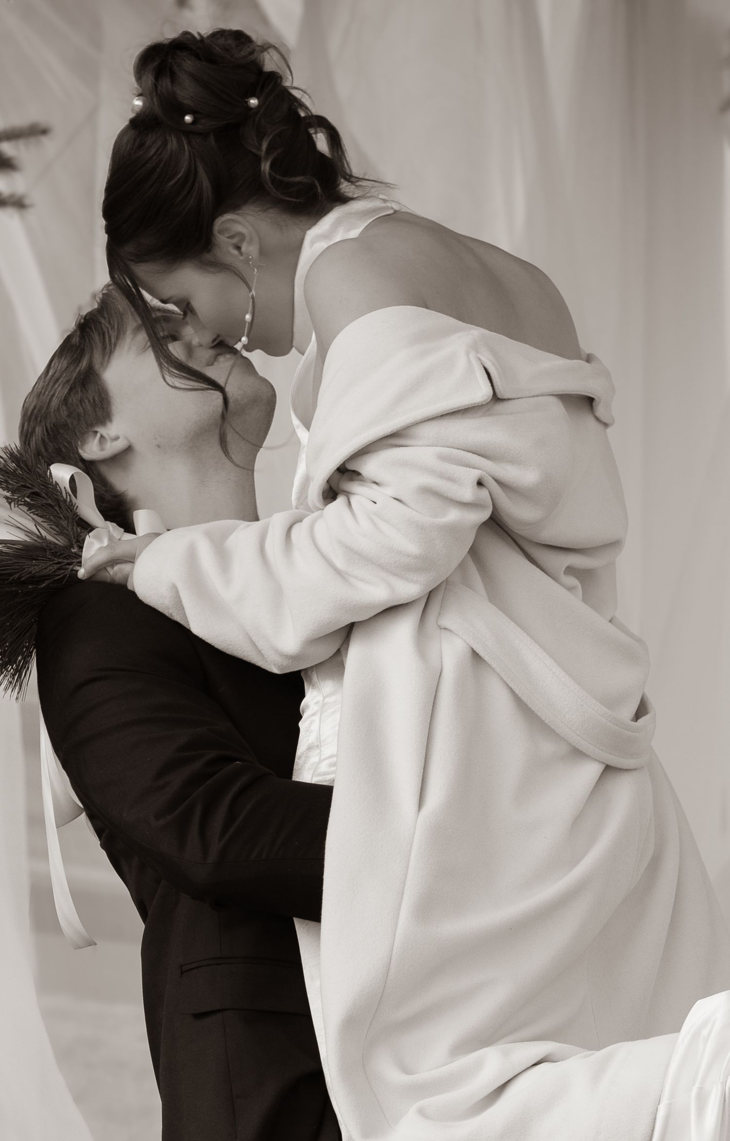 A romantic black and white photo sequence shows a couple in formal attire embracing in four progressive shots.