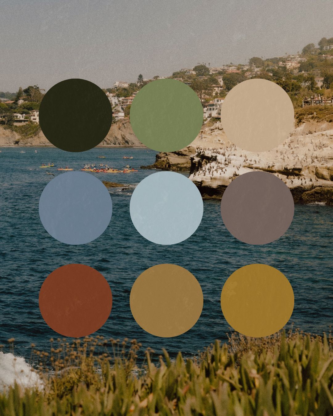 Coastal landscape with rocky cliffs and ocean featuring a color palette of earth tones, blues and sage greens.