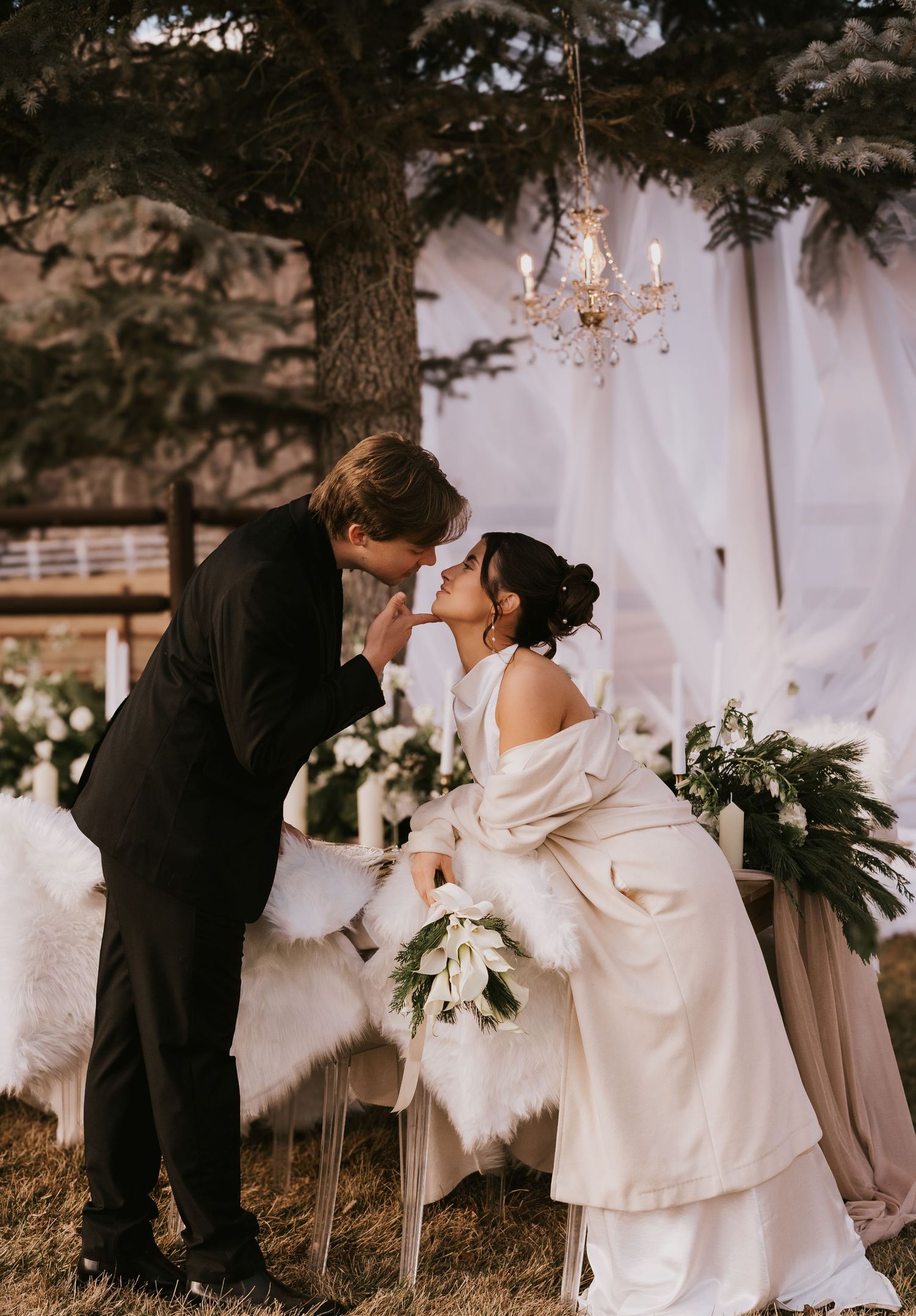 A romantic wedding couple shares intimate moments in a series of black and white photos under an elegant outdoor setting.