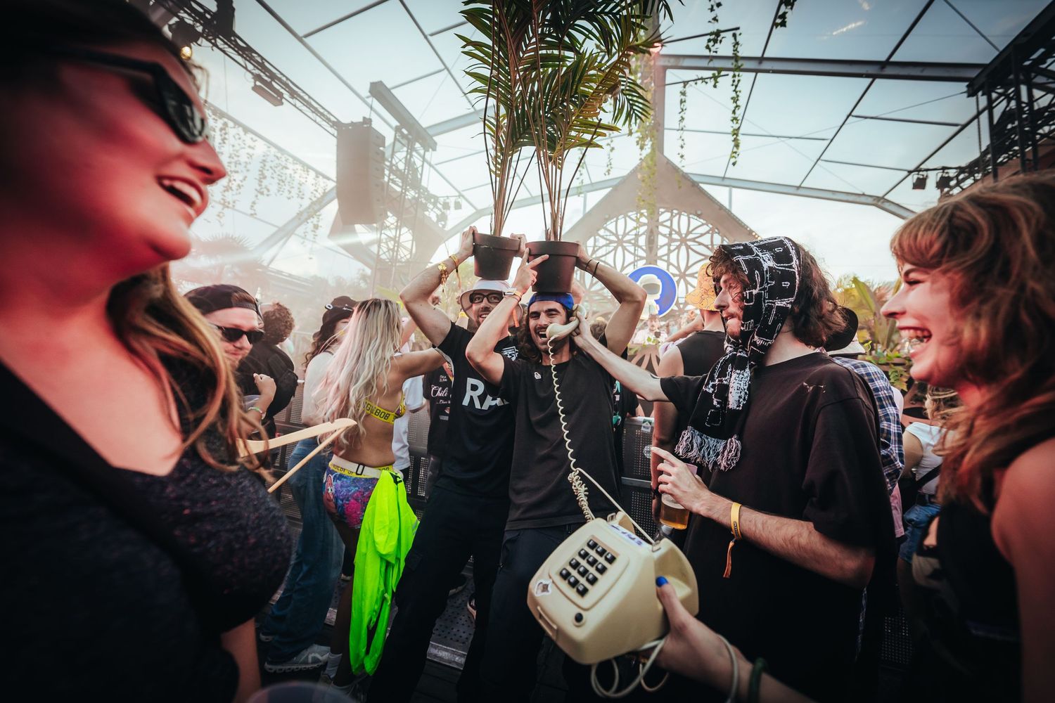 People dancing together at indoor festival stage