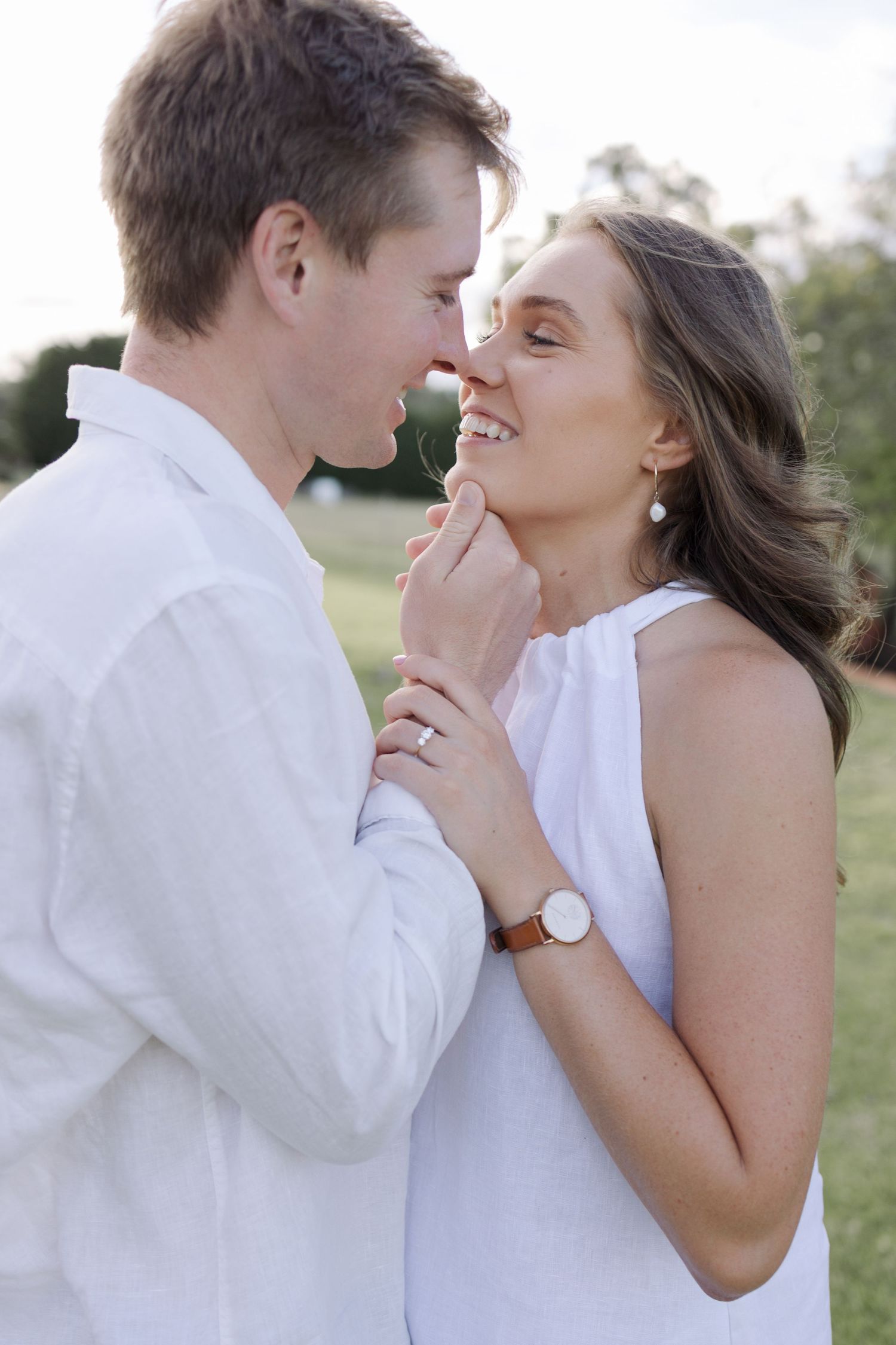 couple sharing tender moment outdoors, lifestyle couples engagement photography Inverell NSW