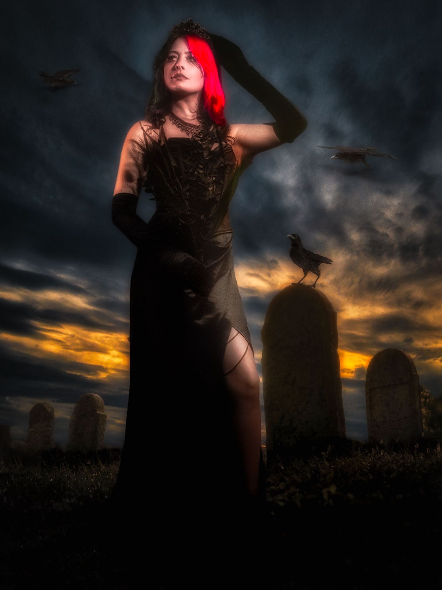 A gothic woman in a black gown stands in a dark graveyard with ravens and stormy skies, her hair glowing red.