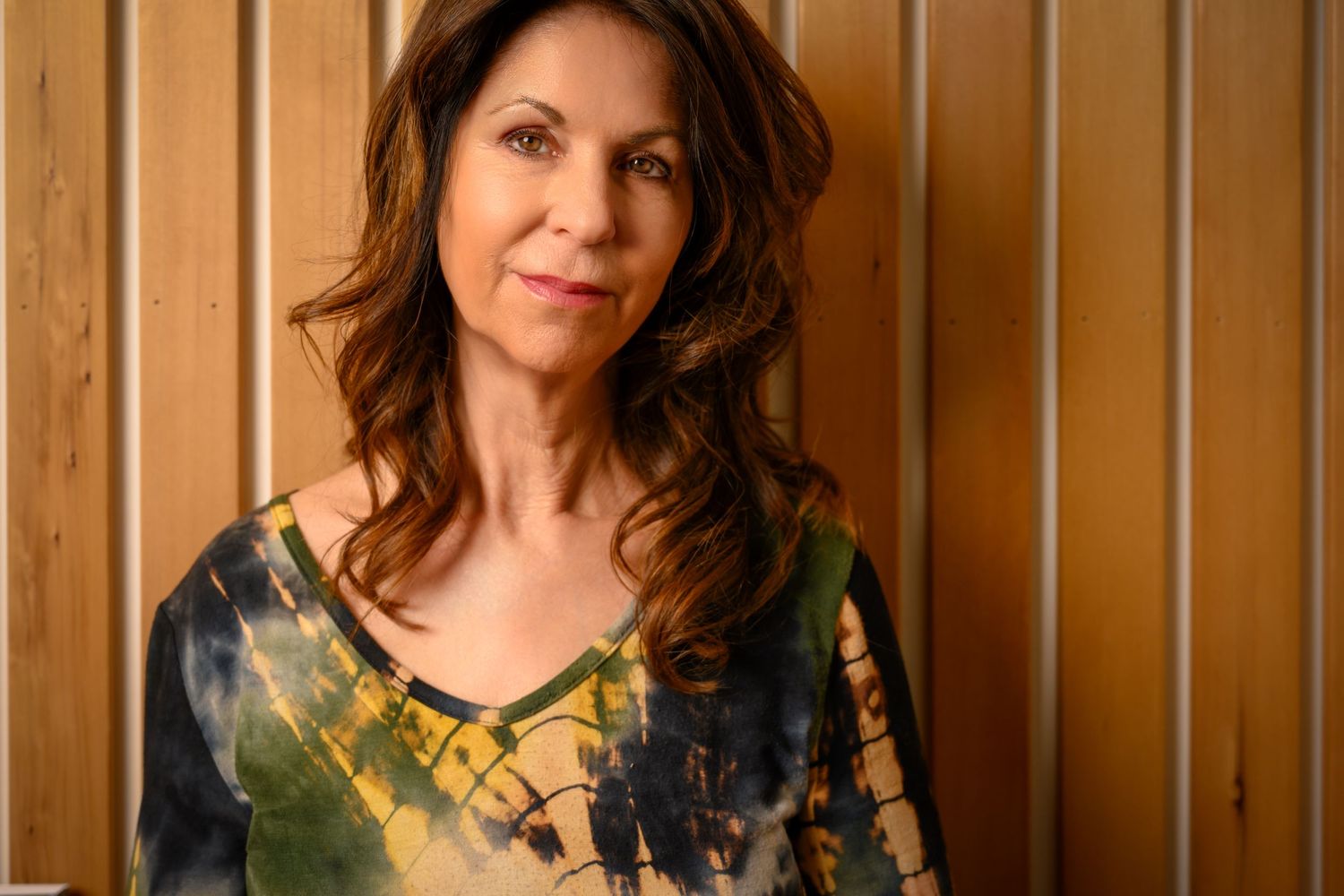Portrait series against wooden paneled wall showing casual expressions and poses.
