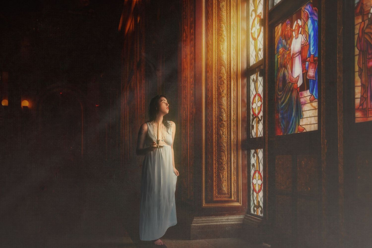 Atmospheric portraits in church or cathedral with dramatic stained glass window lighting.