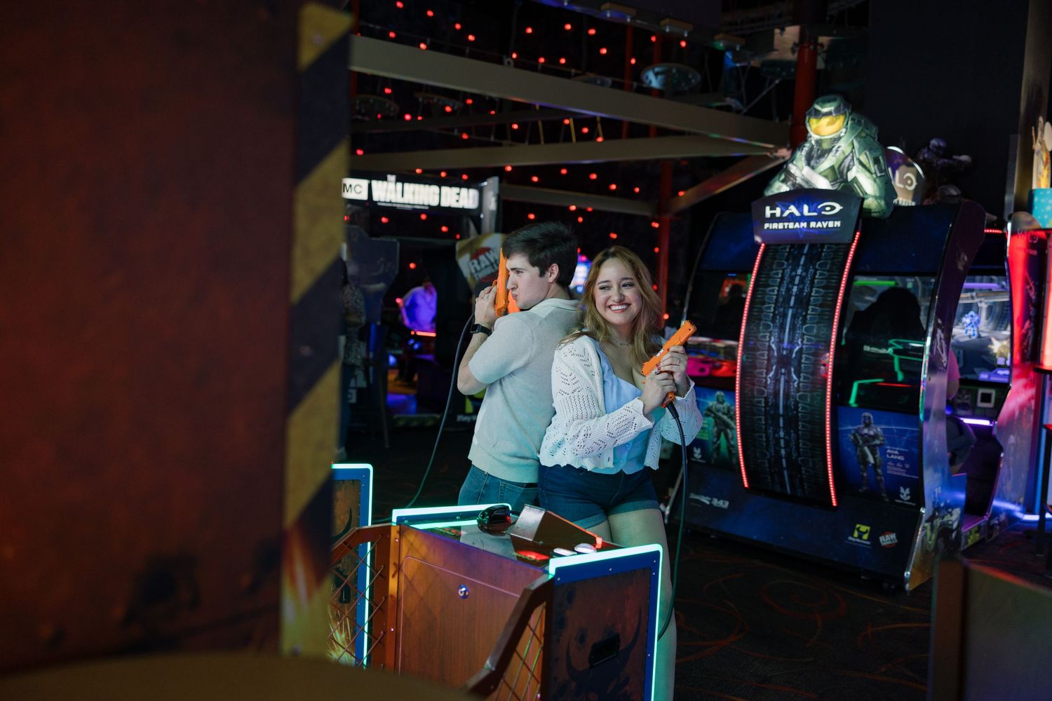 Arcade gaming scene with neon lights and entertainment machines visible.