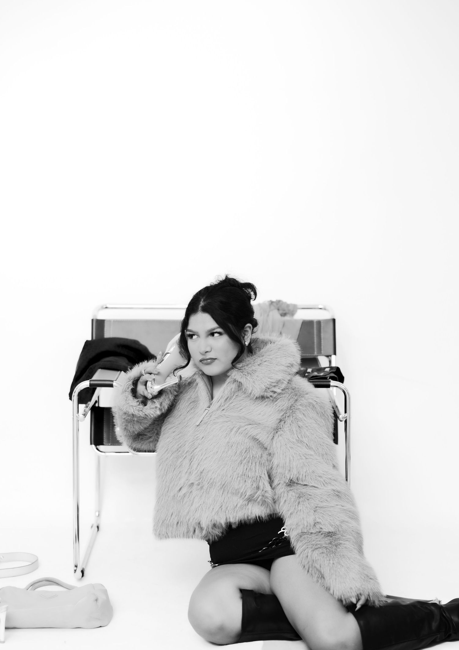 Dramatic black and white photos with fur coat on white background.