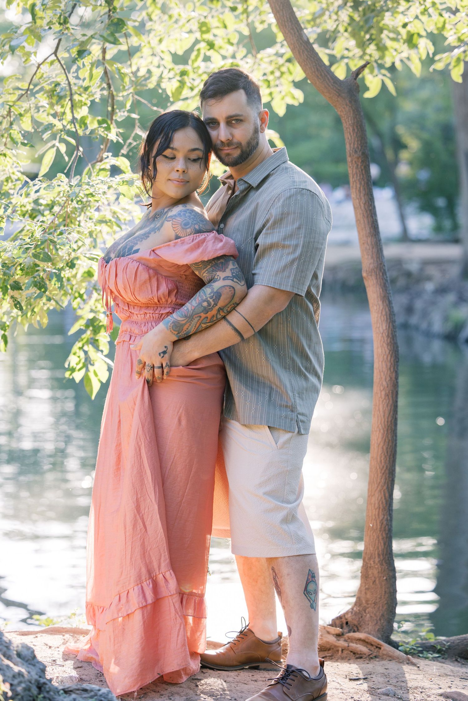 Sweet candid moments of a couple embracing during their waterfront photo session.