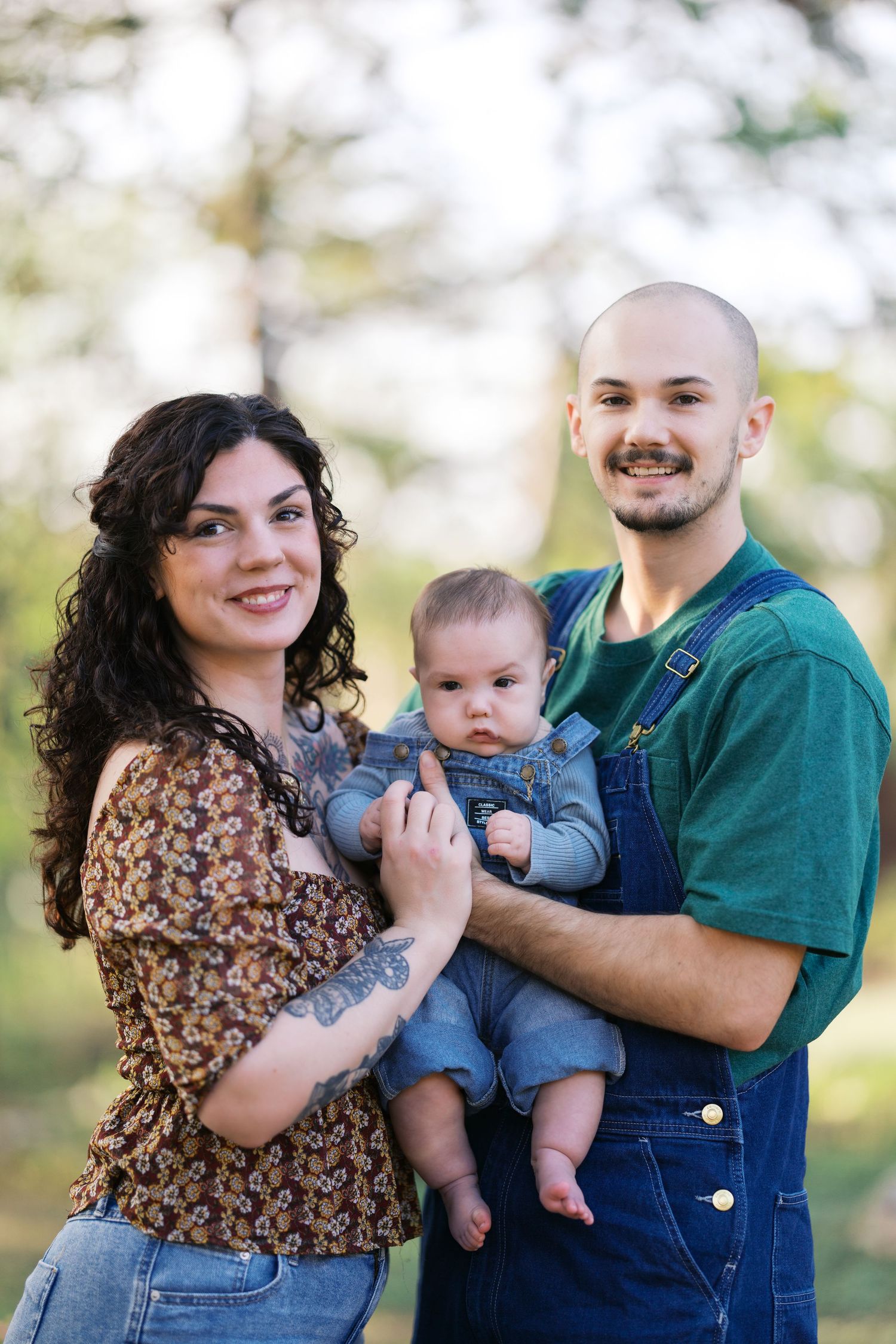 Family portrait session outdoors showing joyful interactions and casual attire.