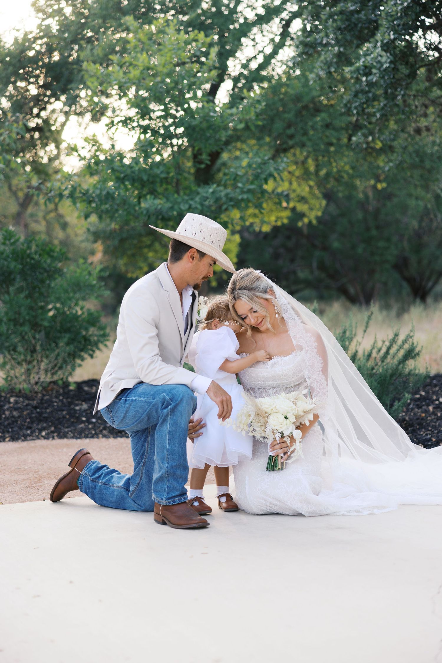 Candid wedding moments captured on white backdrop with western attire and natural scenery.