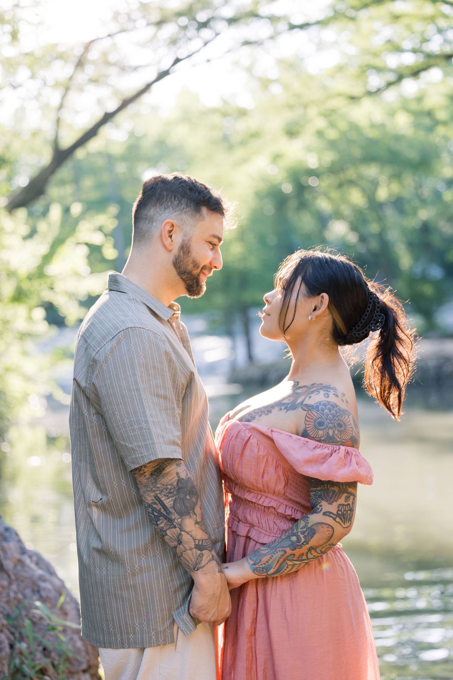 Intimate couple's portraits showing affection and laughter by a tranquil lake.