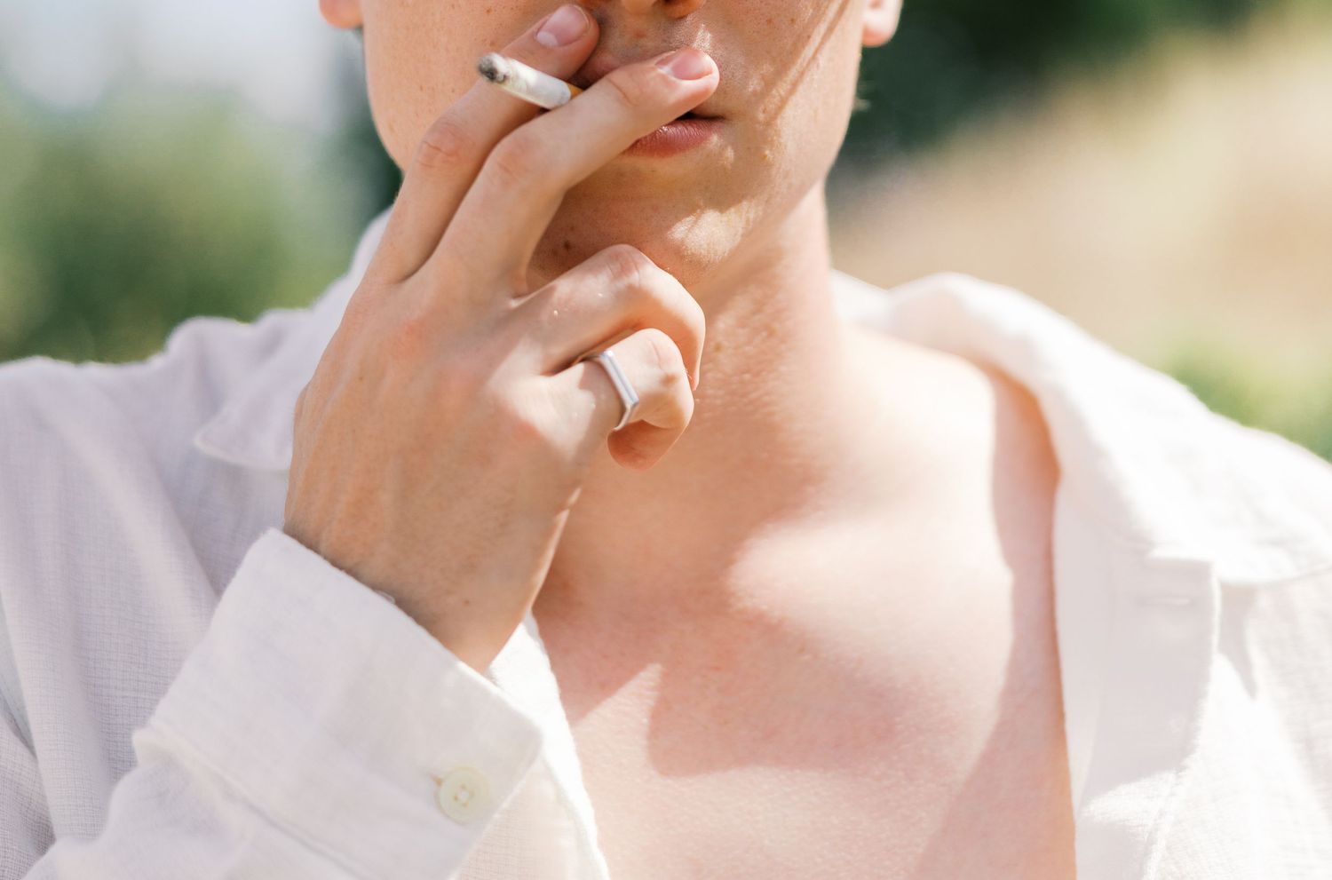Close-up artistic portrait with soft lighting and delicate hand gestures.