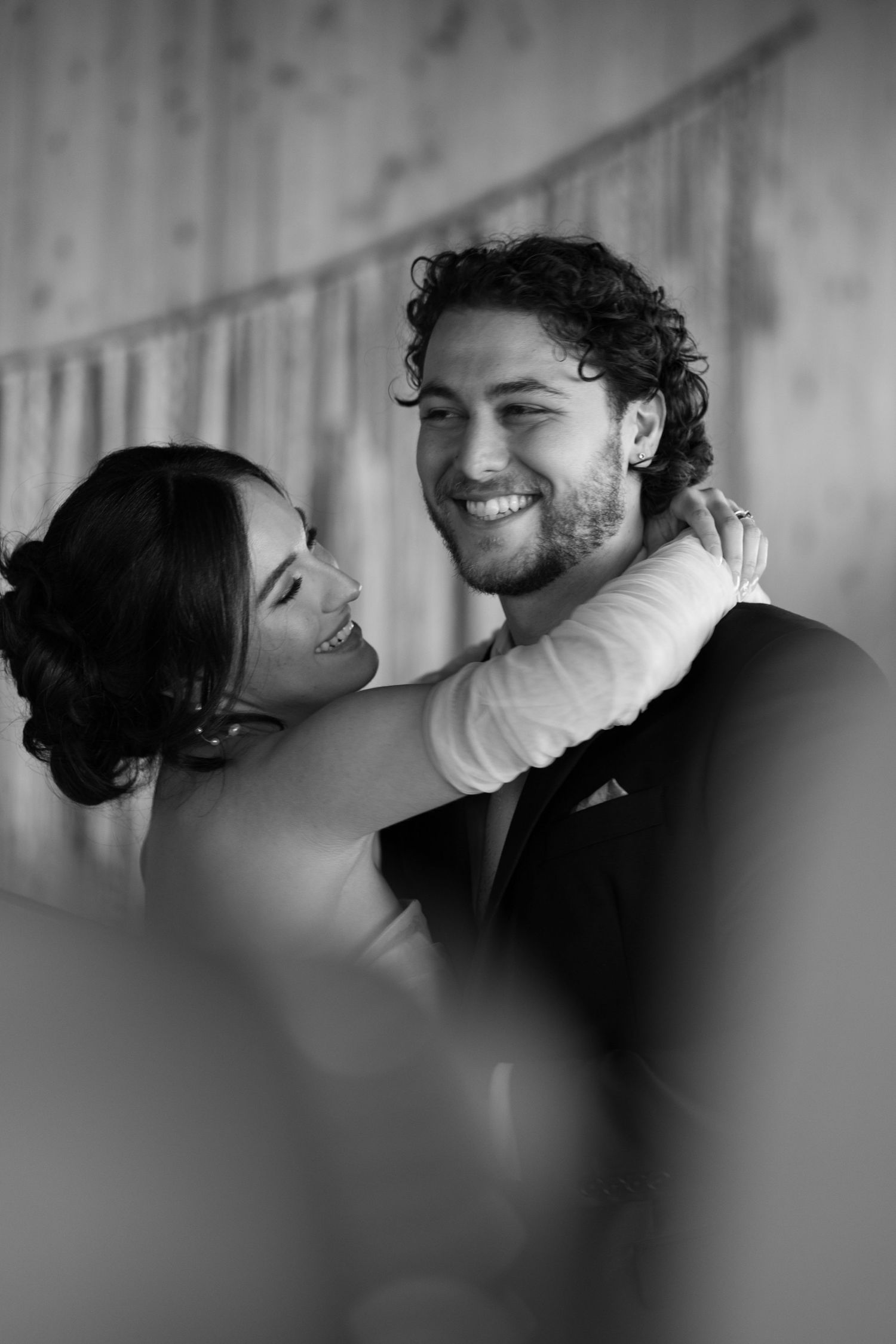 Intimate black and white close-up portraits showing tender moments between newlyweds.