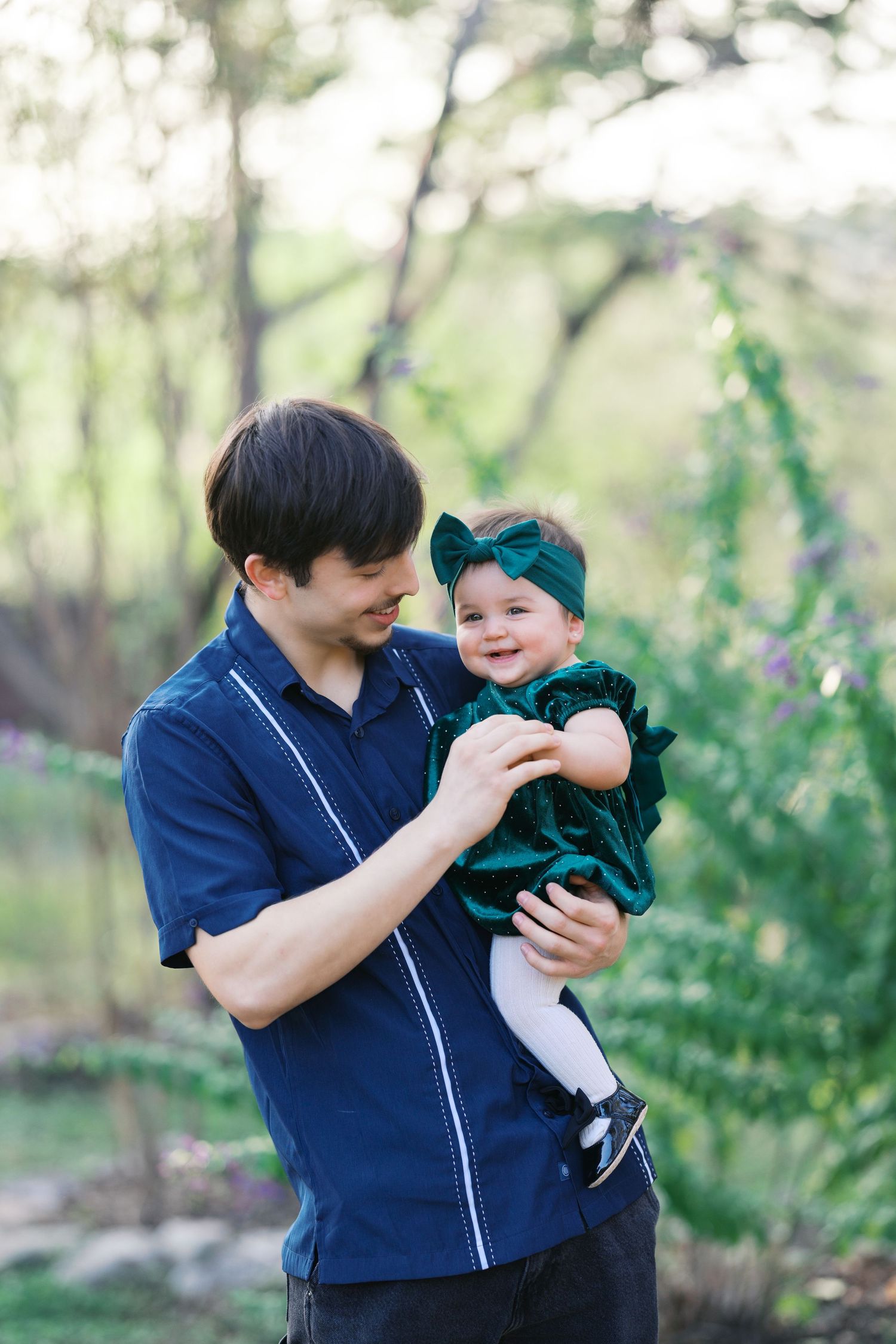 Tender interaction between two people during an outdoor photo session.