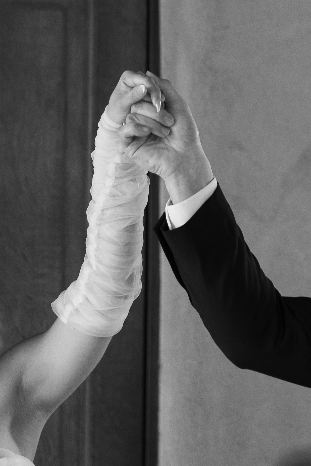 Artistic black and white series of hands joining together in an elegant dance pose.